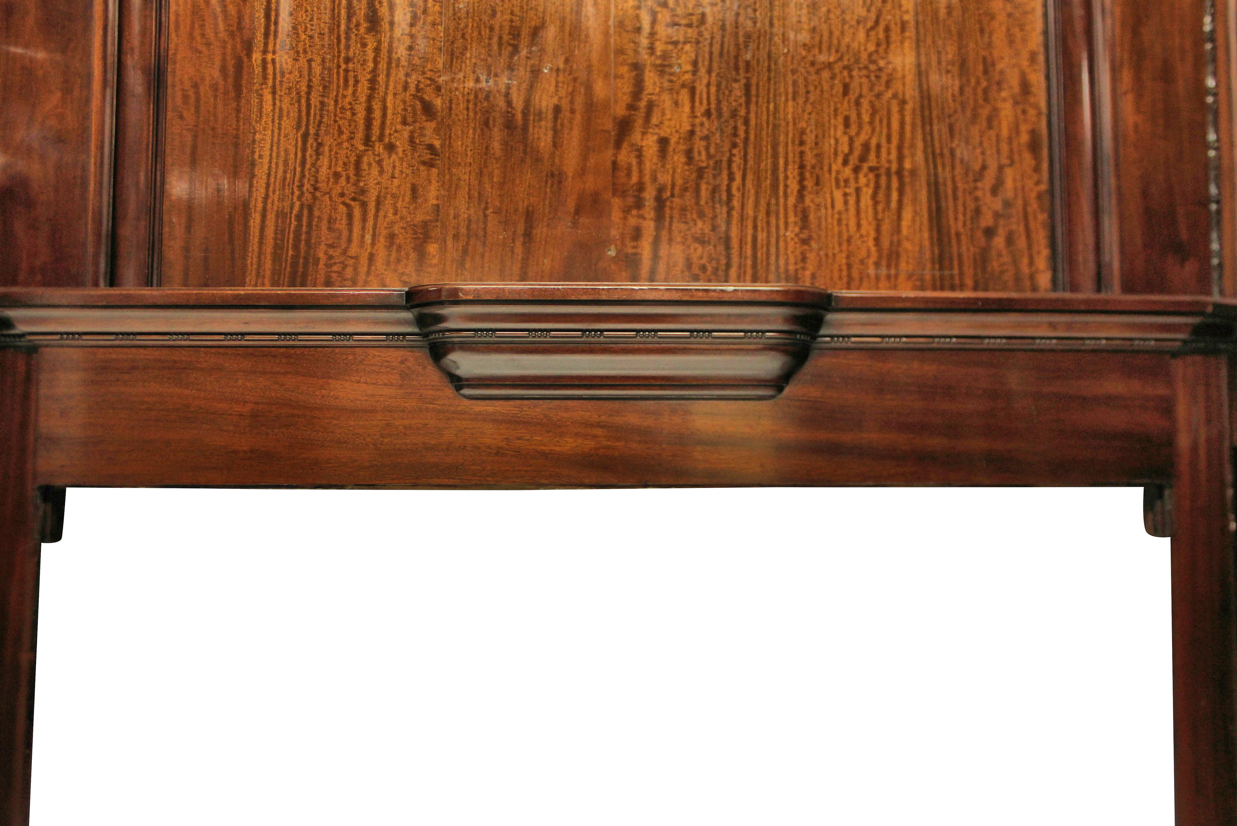 A rare opportunity to own a piece of furniture designed by Sir Edwin Lutyens.
This large chimneypiece was designed by Lutyens for Papillon Hall, England in 1903. It is made of hand carved mahogany with a beautiful patina. There is a deep mantel
