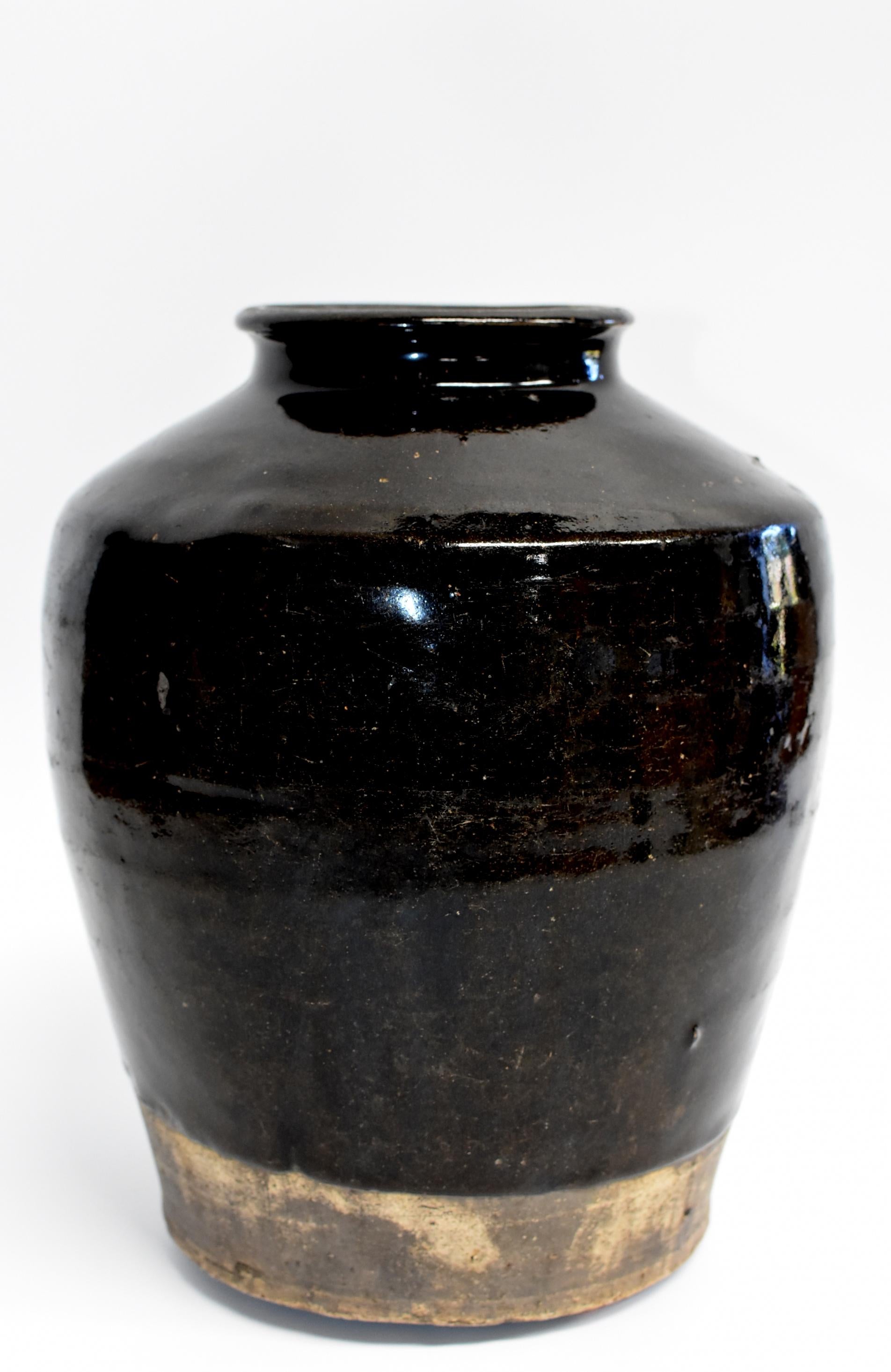 This wonderful piece is from Shanxi province, an ancient state of China. The area is famous for producing rich, aromatic, dark vinegar. Historically these jars were used to store the prized liquids. Now, their rustic, artistic appeal with the