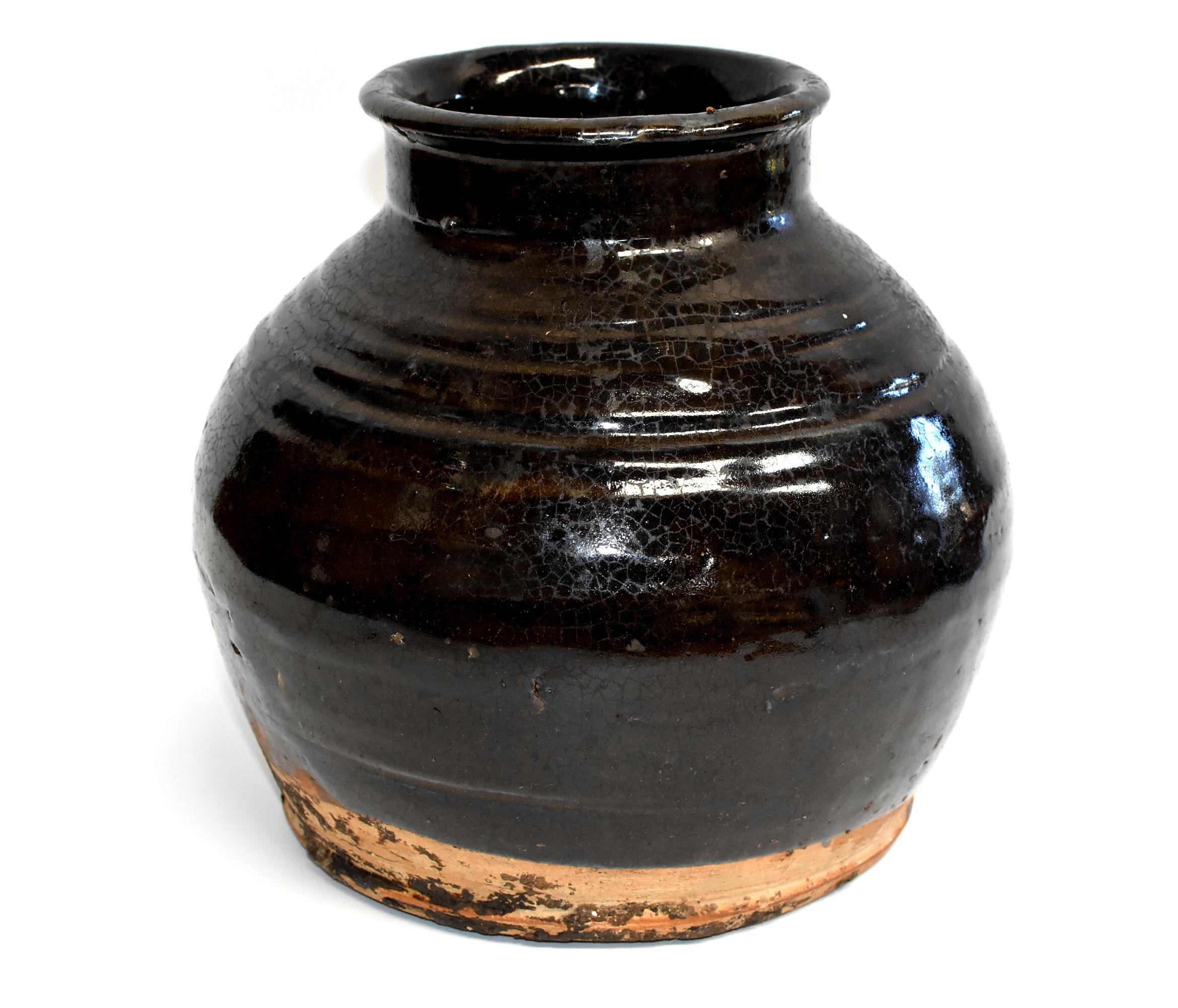 This wonderful piece is from Shan Xi province, an ancient state of China. The area is famous for producing rich, aromatic, dark vinegar. Historically these jars were used to store the prized liquids. Now, their rustic, artistic appeal with the