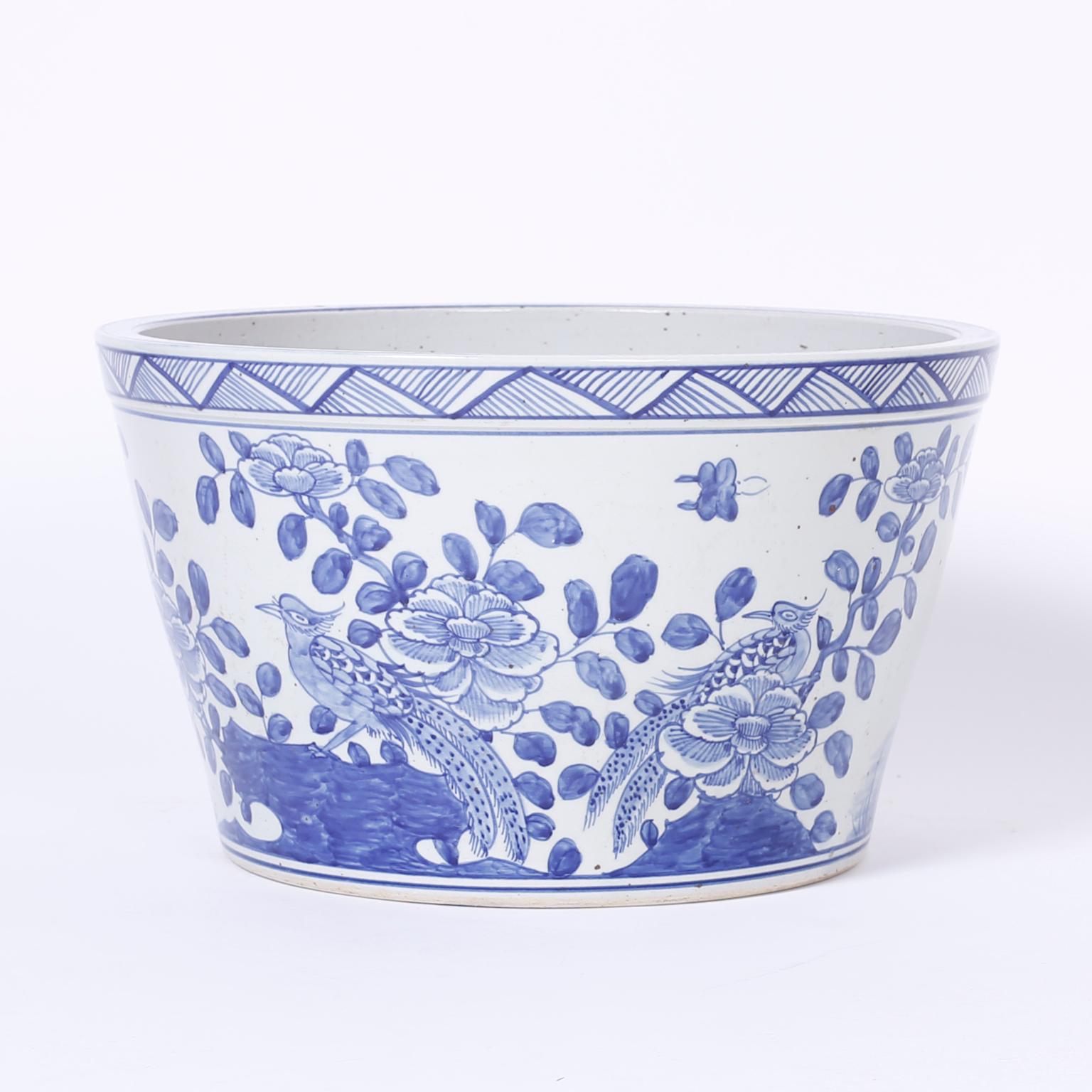 Chinese blue and white porcelain tapered bowl or planter decorated with peacocks and flowers on the fronts and bamboo shoots on the backsides, in the Chinese Export manner.