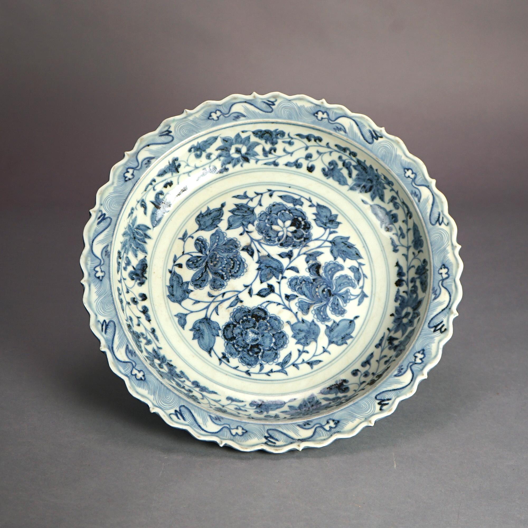 Large Chinese Blue & White Floral Design Porcelain Charger Bowl with Stylized Wave Rim 20th

Measures- 3.25''H x 17.75''W x 17.75''D