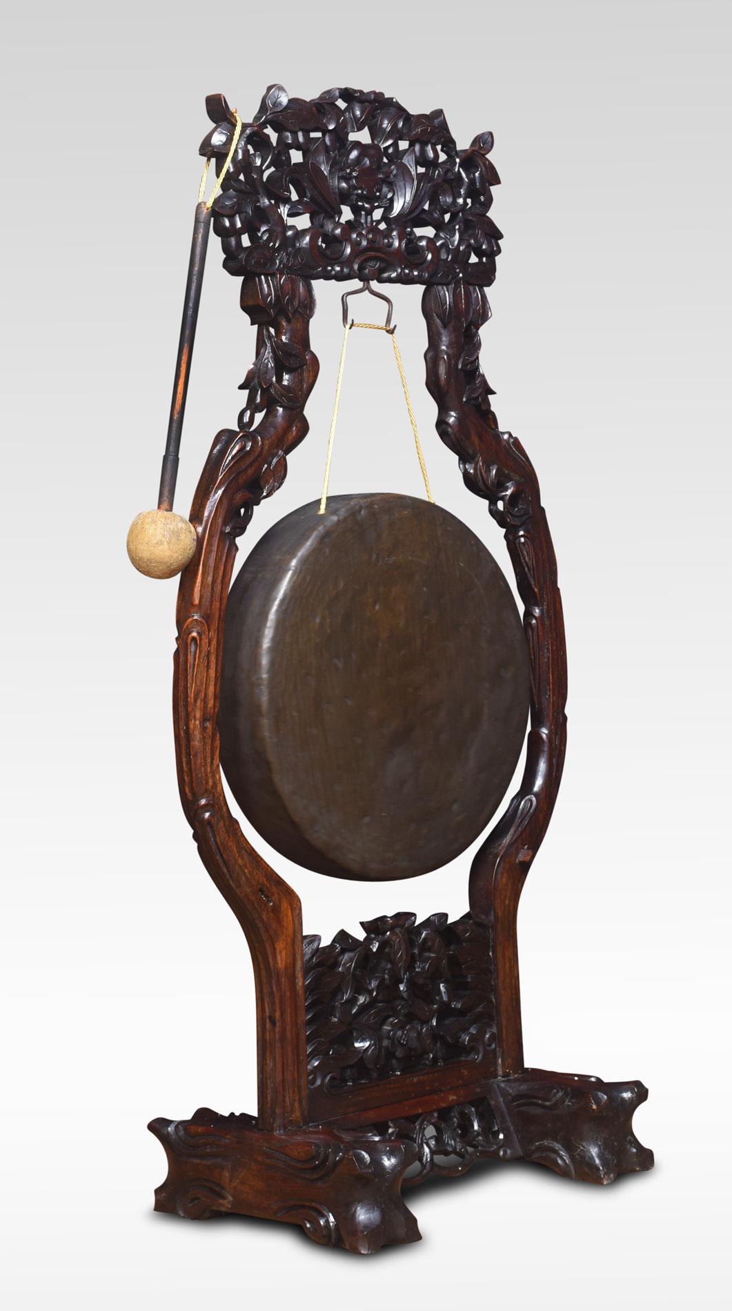 Chinese intricately carved and pierced hardwood dinner gong, having circular brass gong with original beater.
Dimensions
Height 50 inches
Length 24.5 inches
width 13.5 inches.