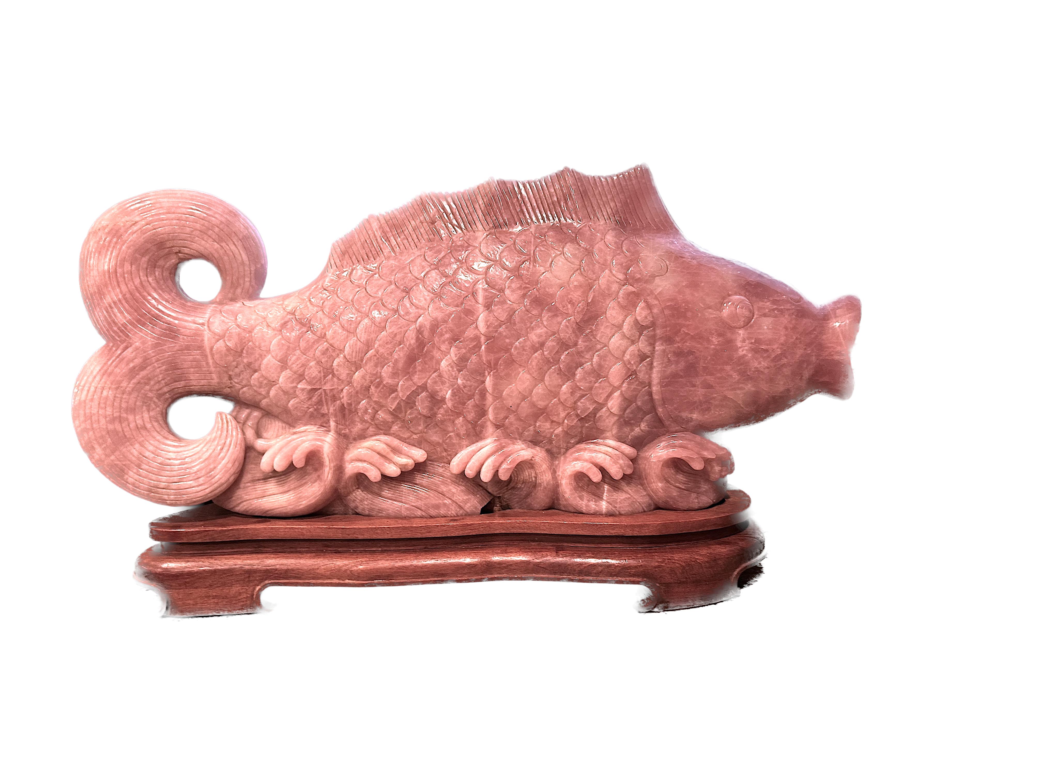 
Large Chinese Carved Rose Quartz Carp
The massive fish with stylized scales, fin and tail, on a wood base.
Height 14.5 in., Width 30 in., Depth
Condition Report
Internal fractures, otherwise in good condition.
