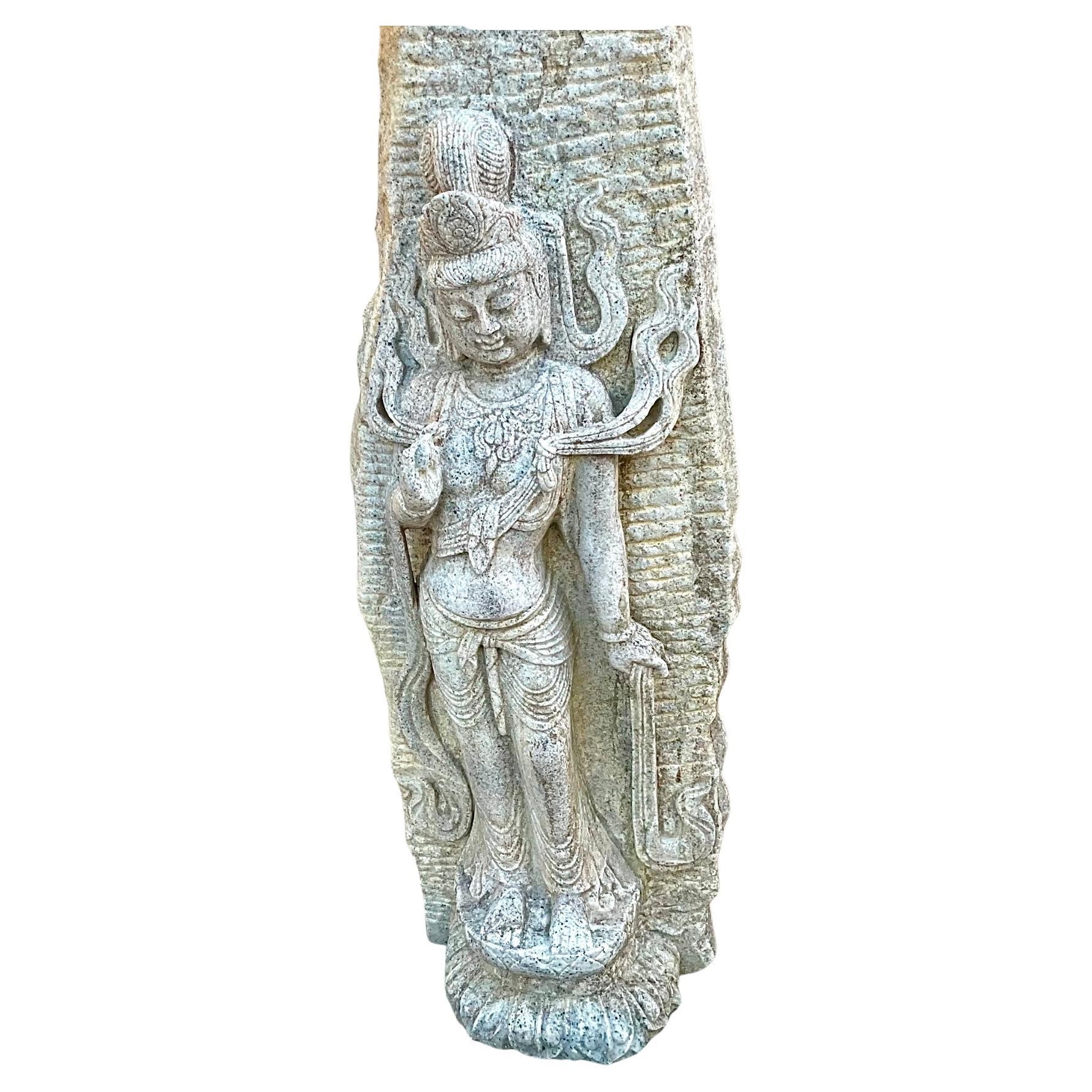 Carved white stone temple sculpture of a Bodhisattva featuring exquisite craftmanship and attention to detail. Bodhisattvas were enlightened beings who chose to remain in the cycles of rebirth to help all sentient beings achieve enlightenment. These