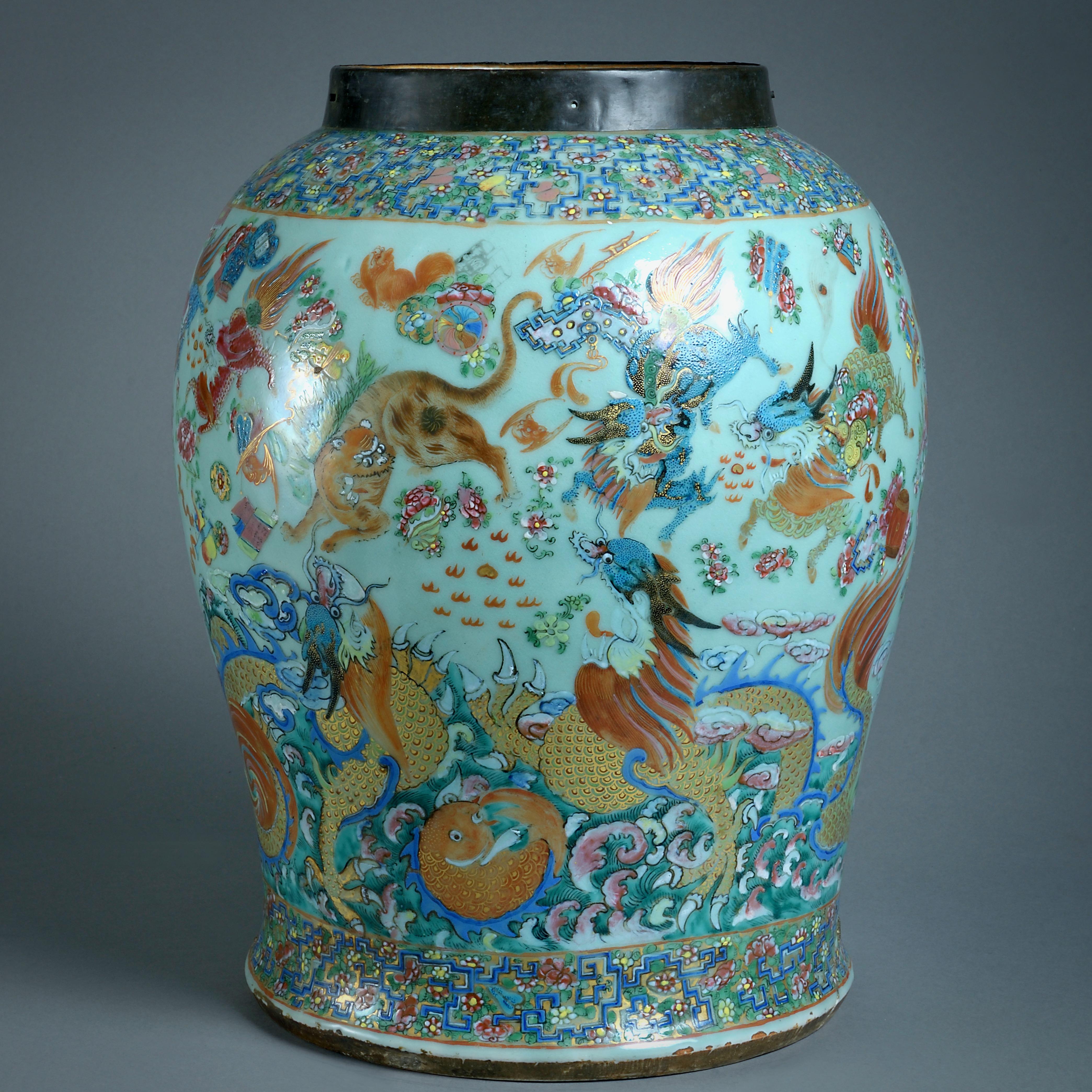 A large Chinese celadon vase decorated with dragons and other motifs, Mid-19th Century.

The neck with a brass collar, the body with an old riveted repair.
