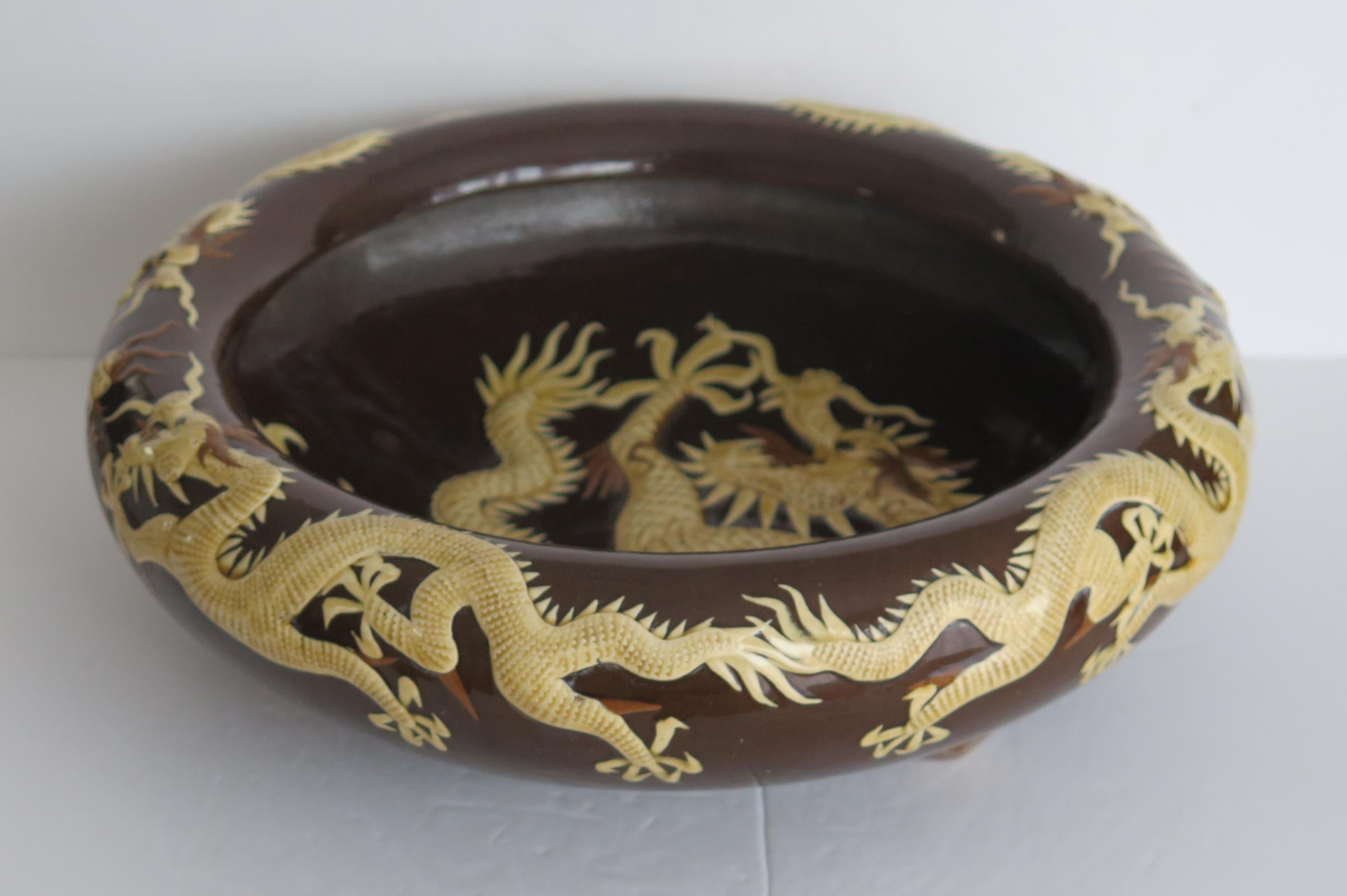 Hand-Crafted Large Chinese Ceramic Bowl Brown Glaze with Cream Dragons in Relief, Circa 1920