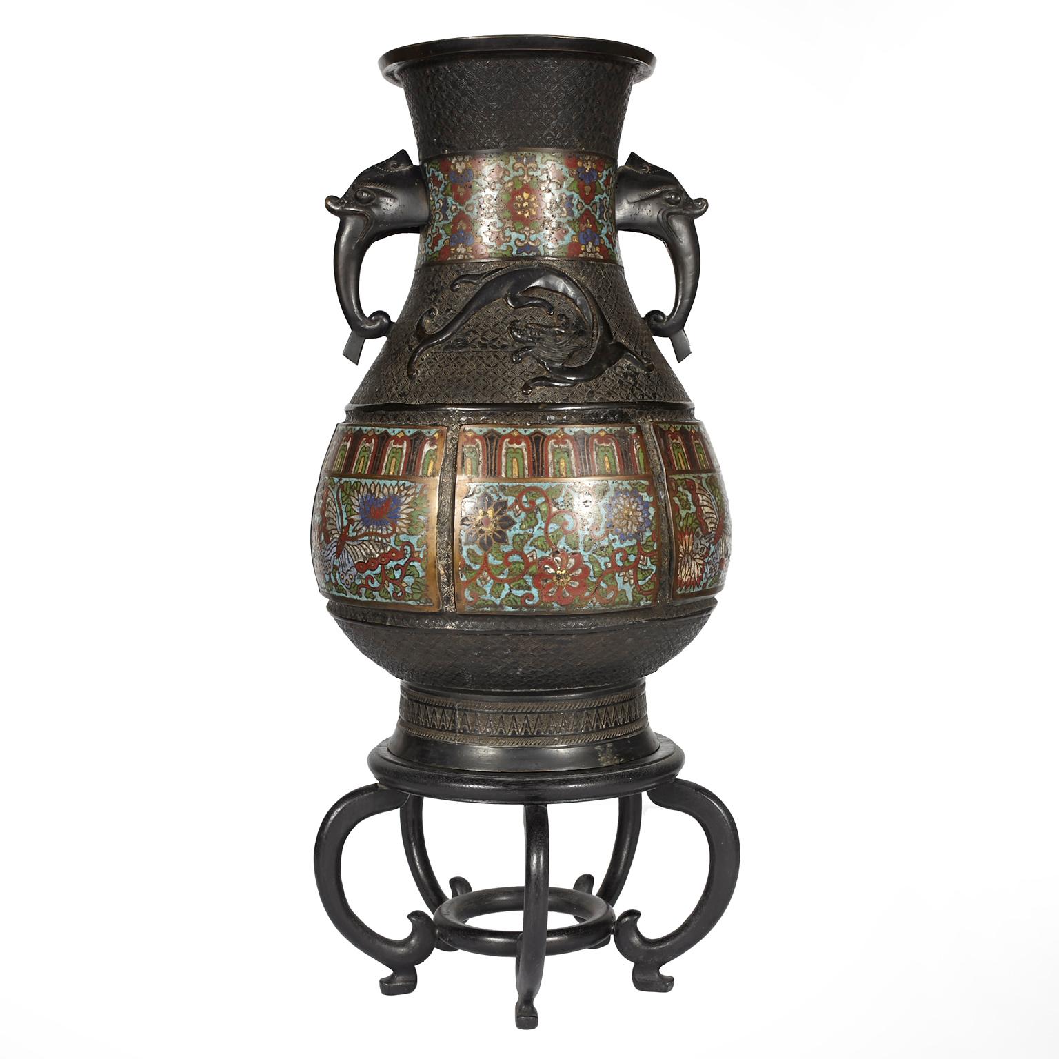 Large Chinese champlevé enamel and bronze vase with rosewood stand. Beautiful addition to any home.