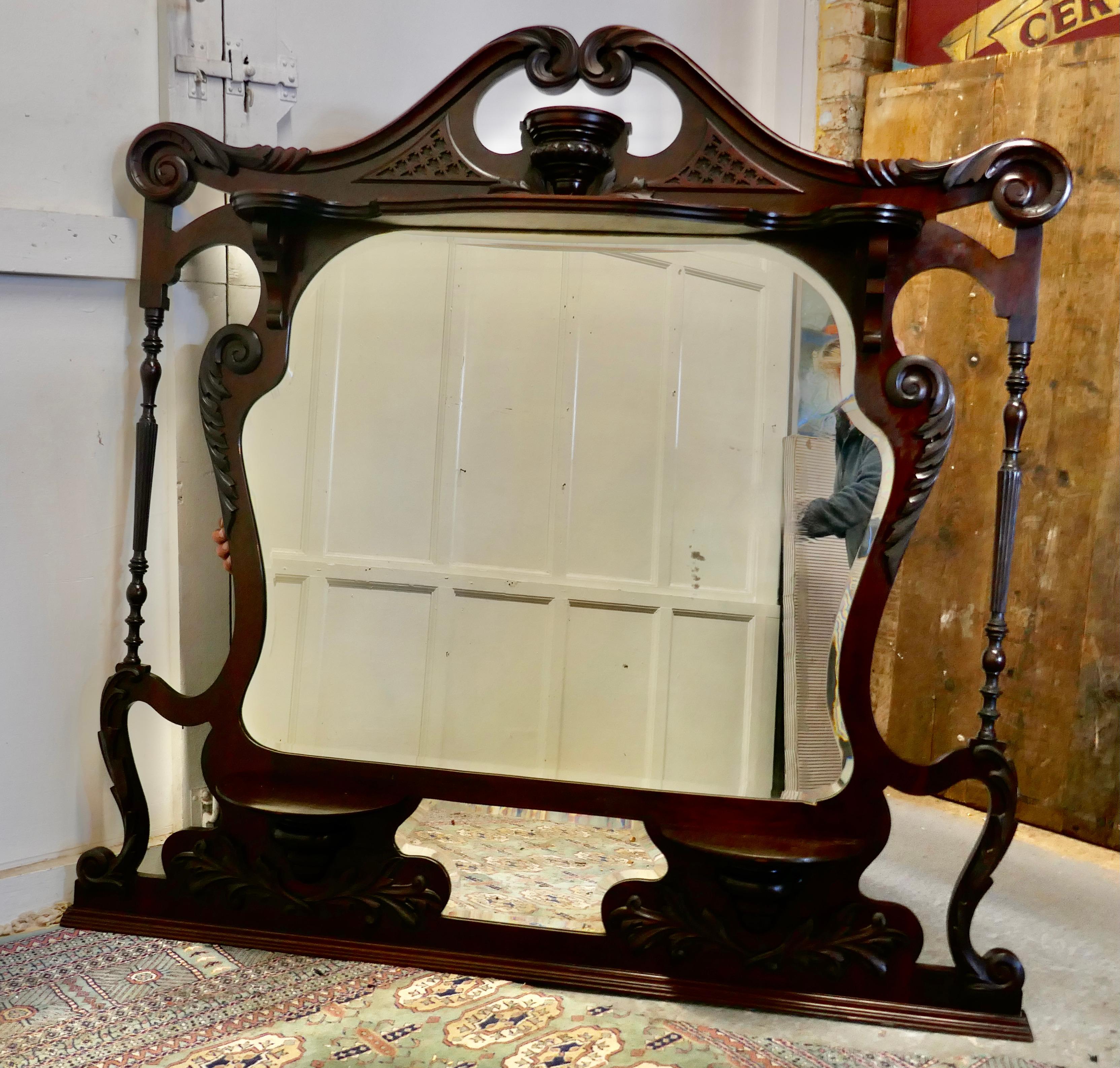 Large Chinese Chippendale mahogany overmantel 

This is a very attractive large piece, it is made in Mahogany, the piece has 2 mirrors set in a superb carved frame, with shelves, columns and decorative cut outs
The Mirror is in good attractive