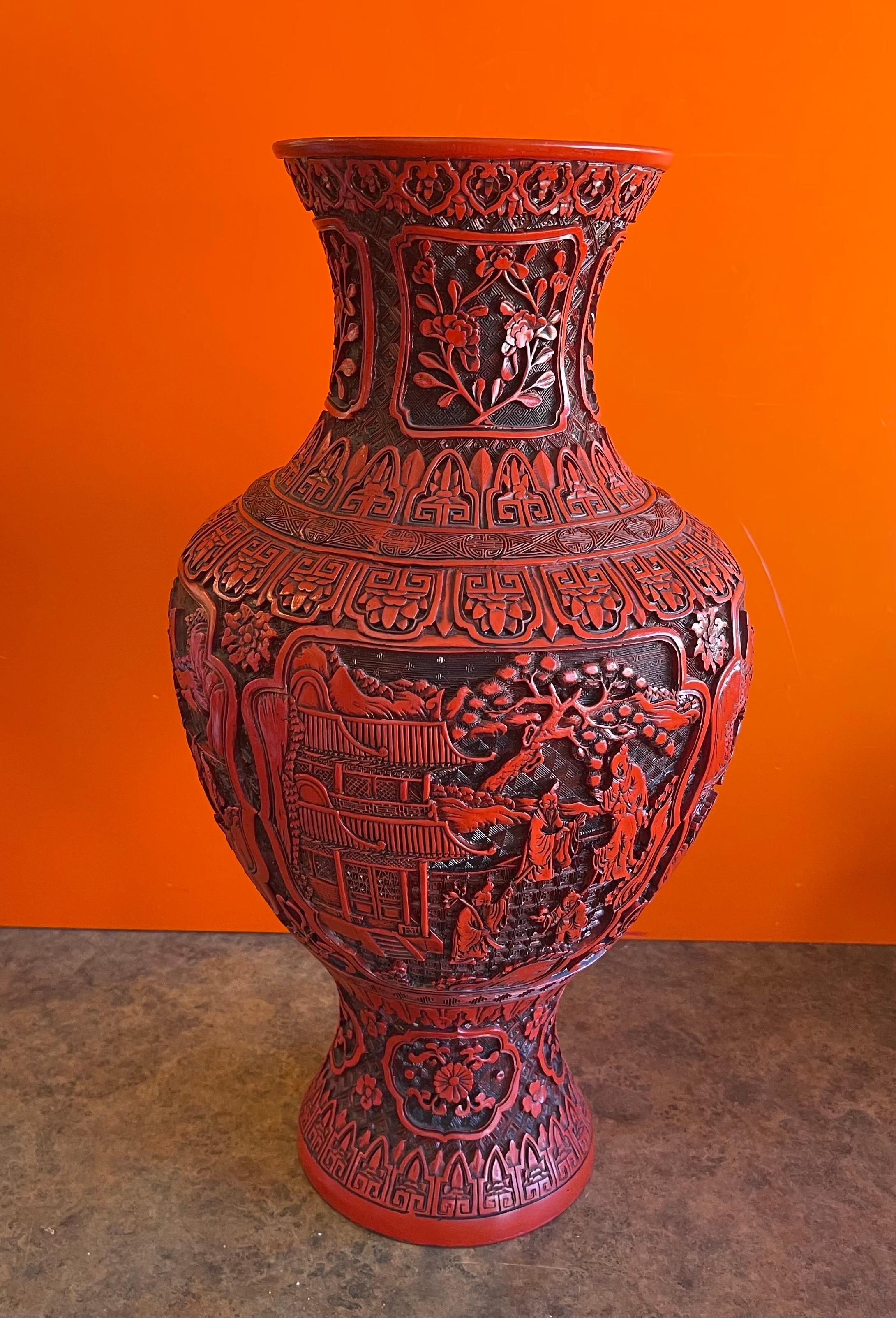 A very large, well crafted Chinese cinnabar lacquered vase with copper / brass lining, circa 1950's. The vase are 19
