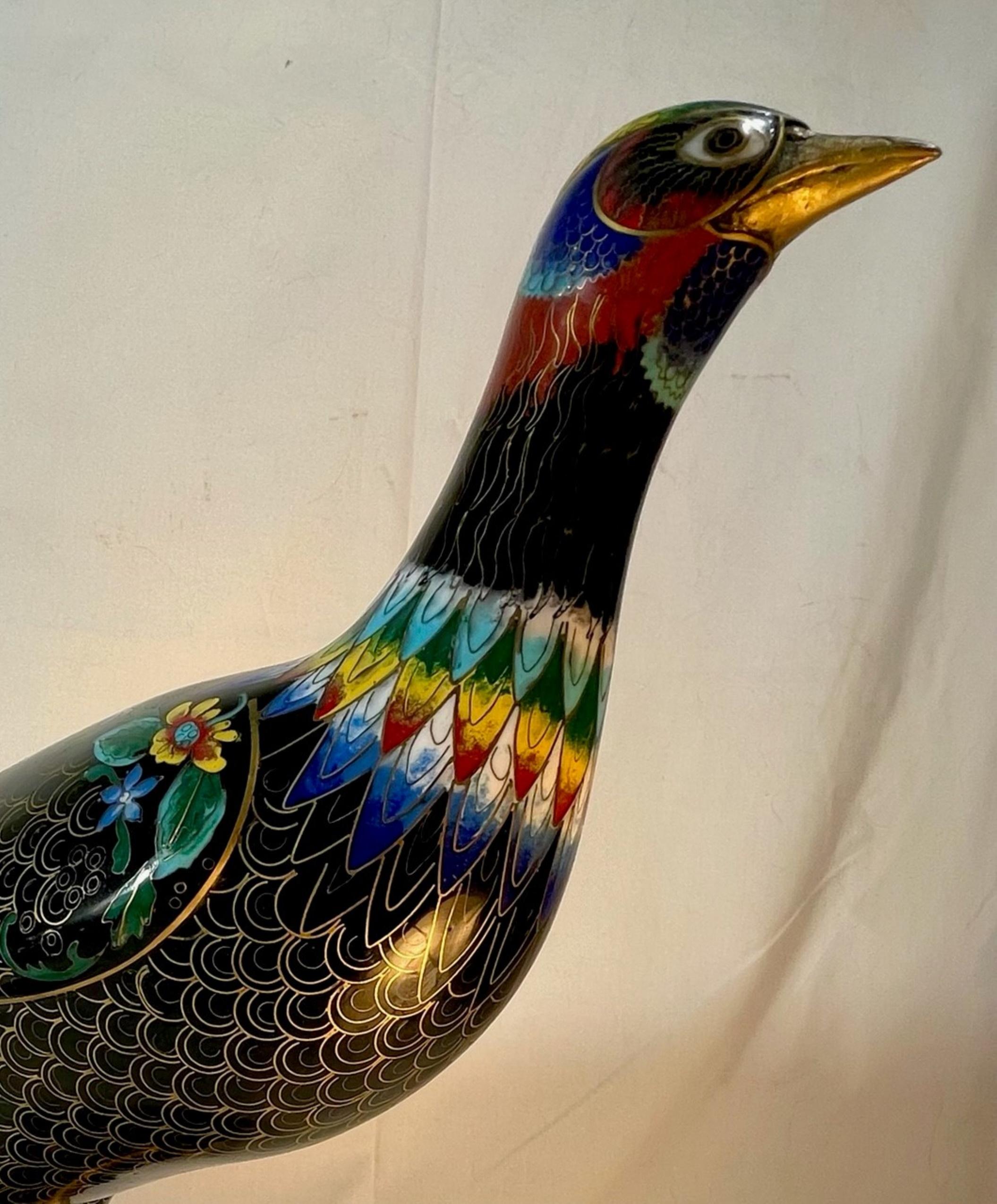 Large Chinese Cloisonne Enamel Pheasant vintage sculpture

A large and exceptional vintage cloisonne pheasant enameled in black, gold with multiple vibrant and beautiful accent colors. Tasteful details abound and include brass claws, feather