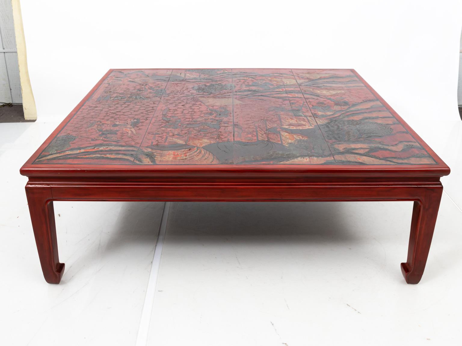 Large Chinese coffee table with decorative, painted tabletop. Please note of wear consistent with age.