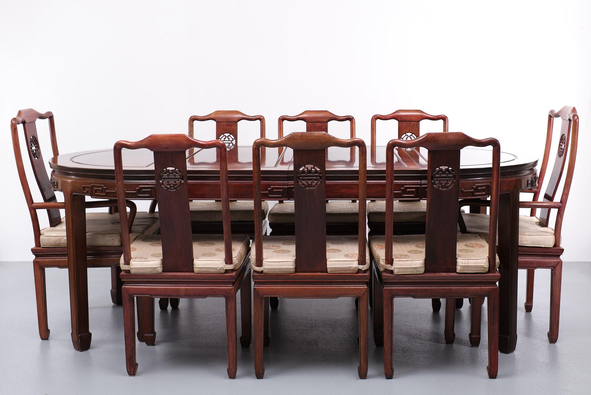 Large Chinese dining set, 8 Chairs 2 armchairs 6 dining chairs, with the original Silk cushions some of the cushions are used comes with a extendable dining table . 
Round table with 2 extra leafs makes it a Oval shaped dining table. hand carved