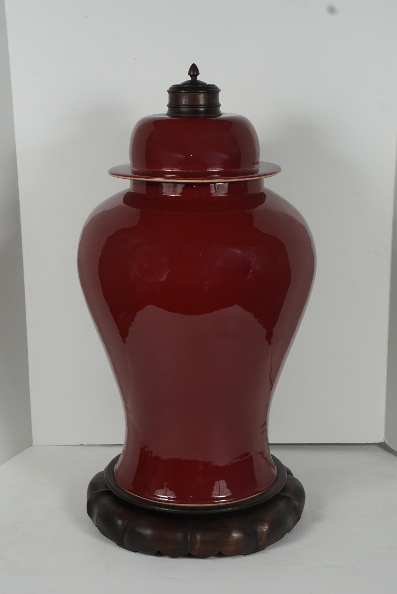 This large vase made in China during the first three decades of the 20th century is of a lovely deep Sang De Boeuf color. Ox Blood in the English language, this opaque deep red color was first developed to perfection in the reign of Kang Hsi during