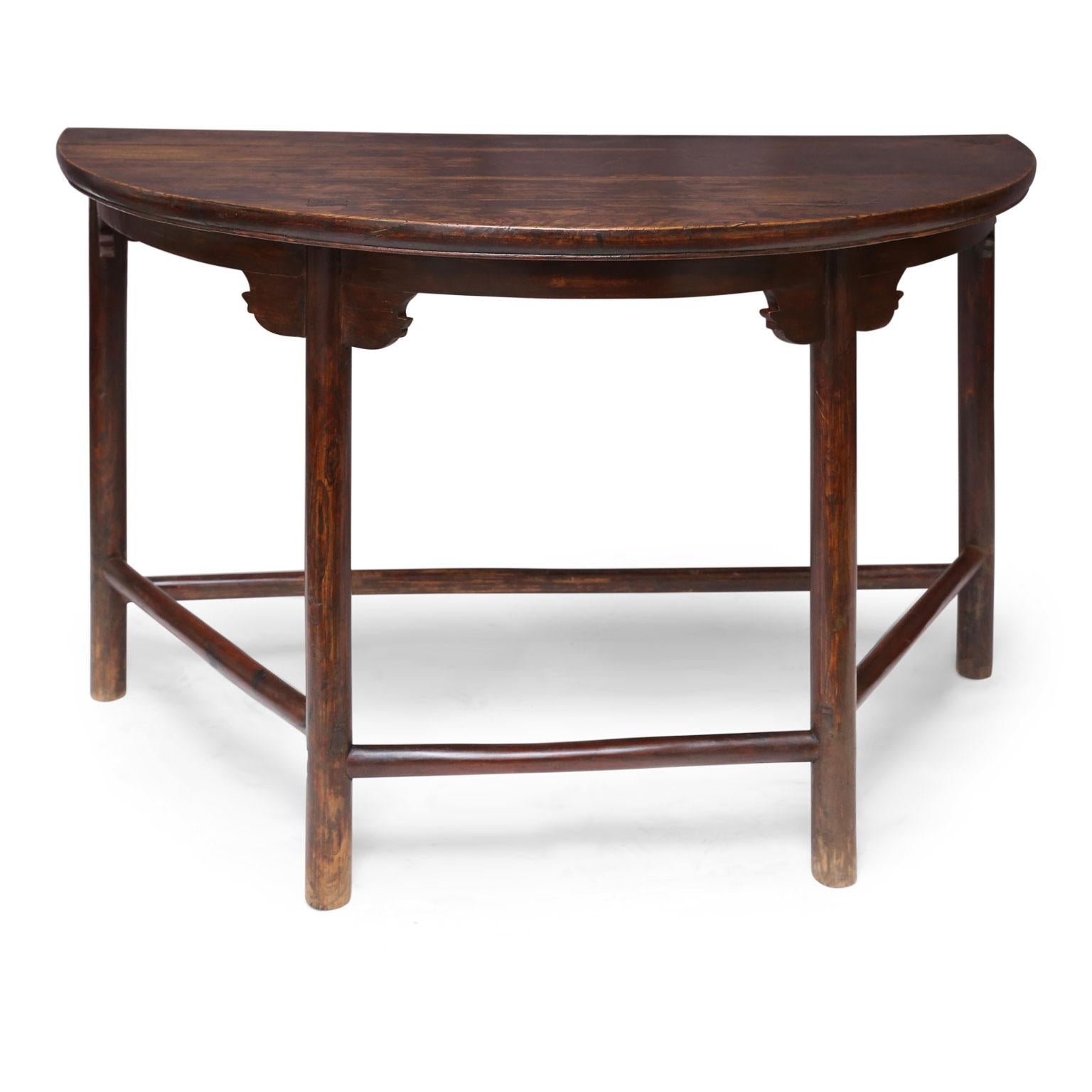 Large Chinese elm demilune console, circa 1910-1930. Remnants of original brown paint and lacquer finish.