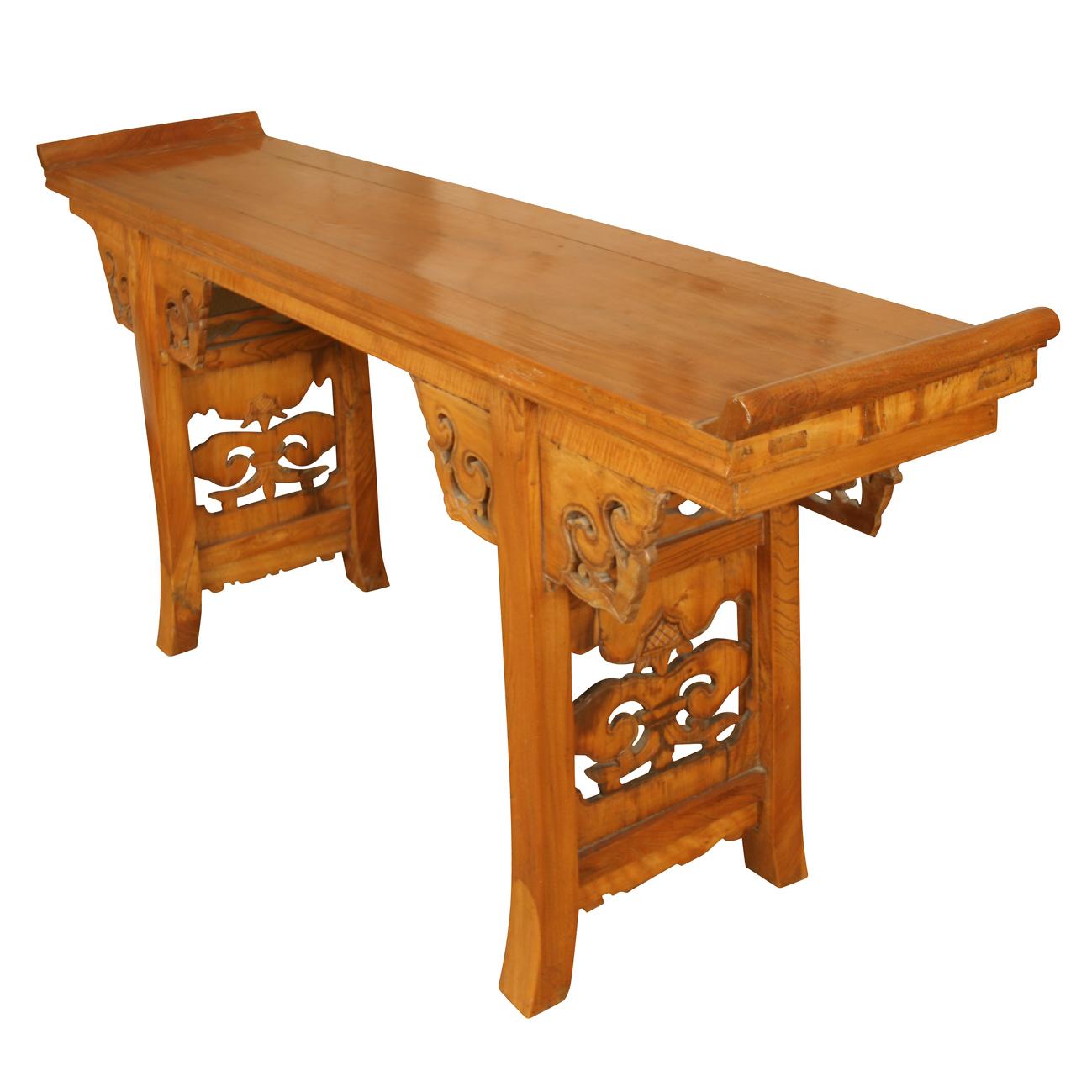 Large Chinese elm wood altar table with scroll carved cut out details to apron and legs.