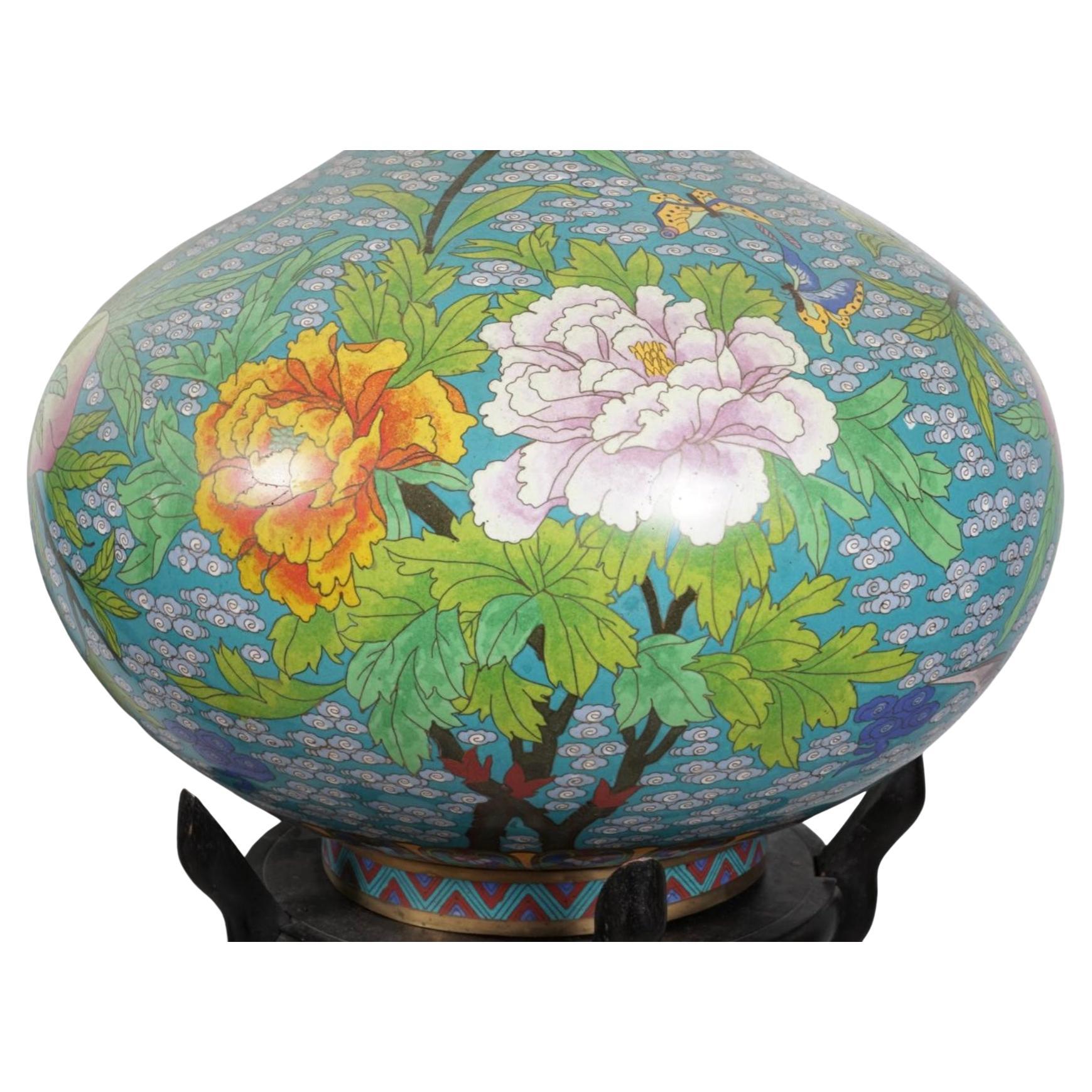  Rare Pair of 19th Century Large Chinese Cloisonné Vases On Stands. These vases are designed using the Cloisonné technique wherein metal wire is used to divide sections of vase, then filled with enamel to create intricate designs. The pattern used