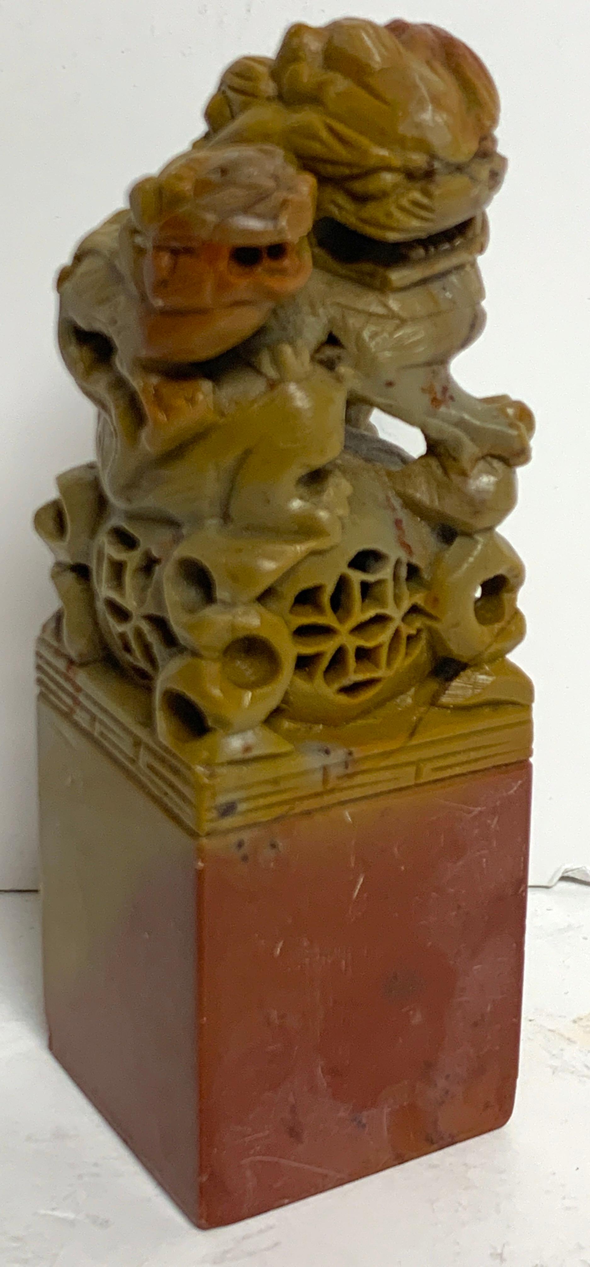 Large Chinese export carved soapstone foo dog scholars seal, nicely carved, in two color soapstone, with large seal at base.