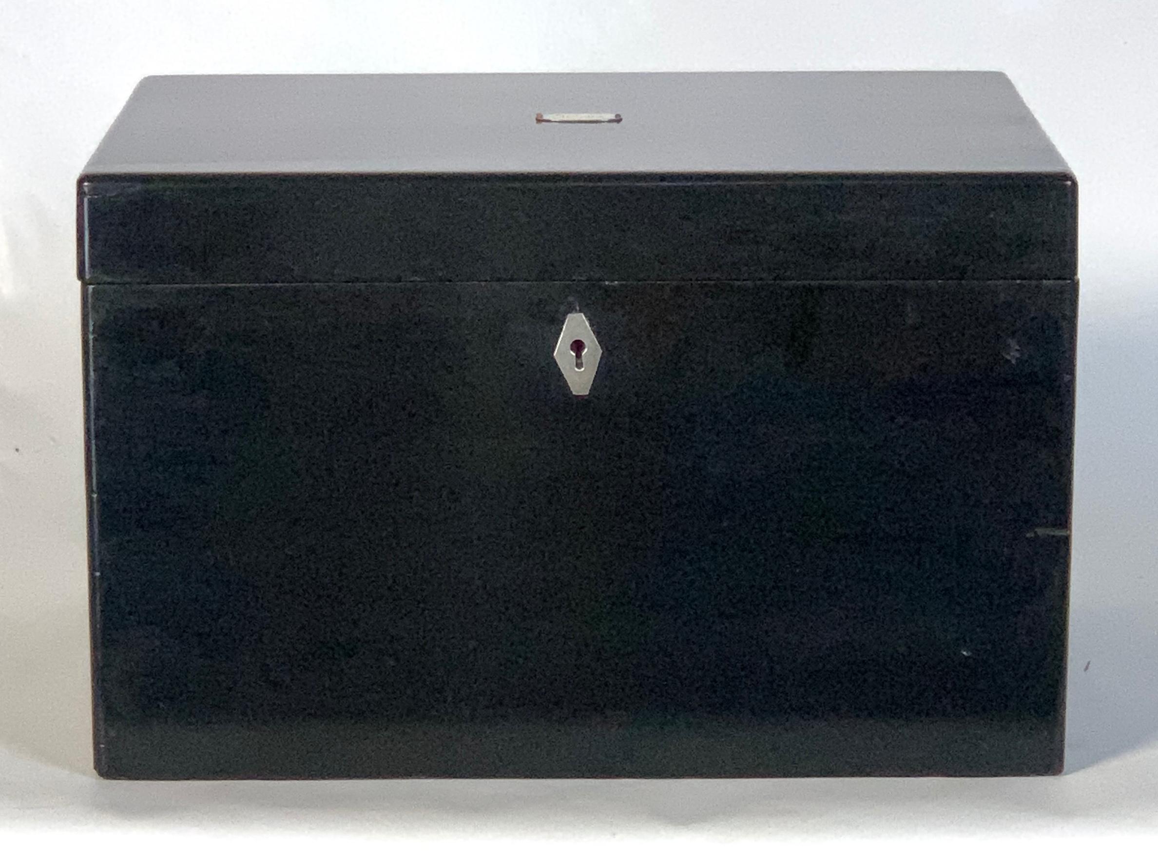 A large Chinese lacquer cigar humidor with engraved silver mount on top opening to reveal a heavily engraved lid and pewter lining.
