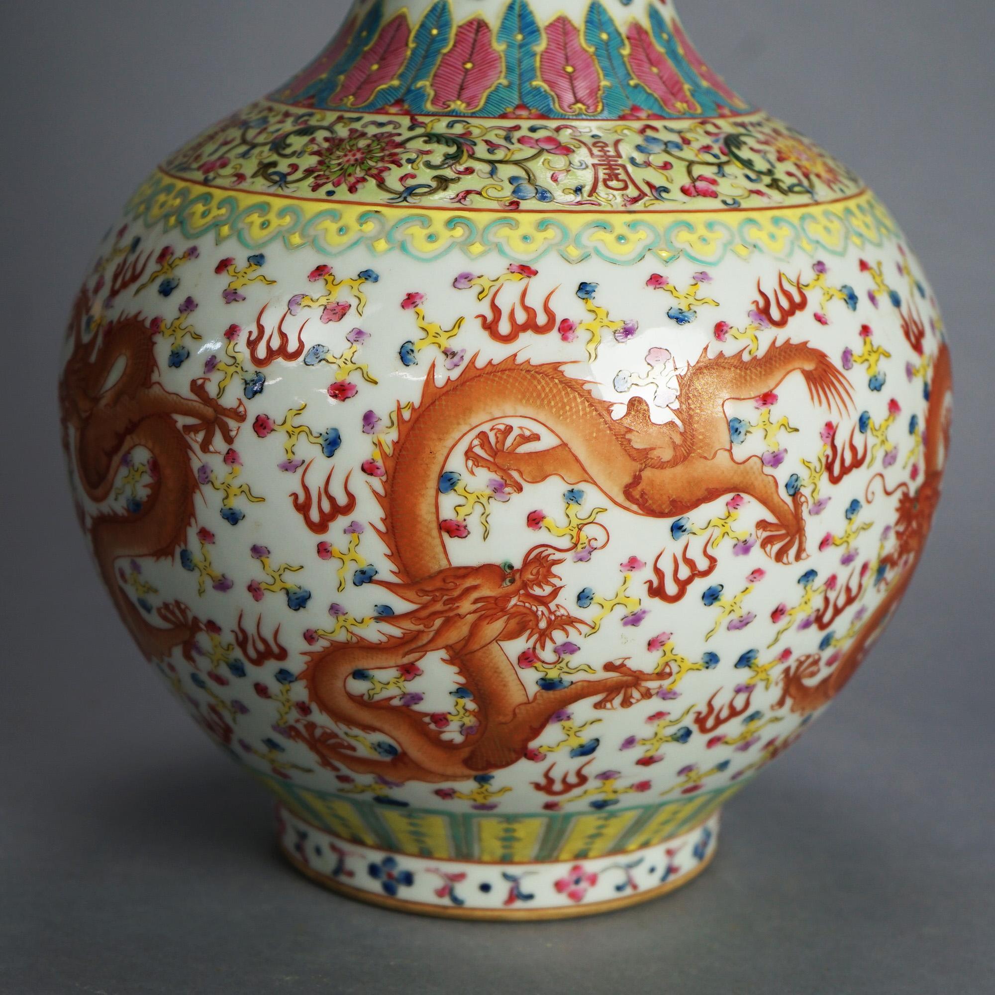 Large Chinese Famille Rose Hu Porcelain Vase with Kangxi Mark, Garden Flowers & Dragons 20thC

Measures - 16.75