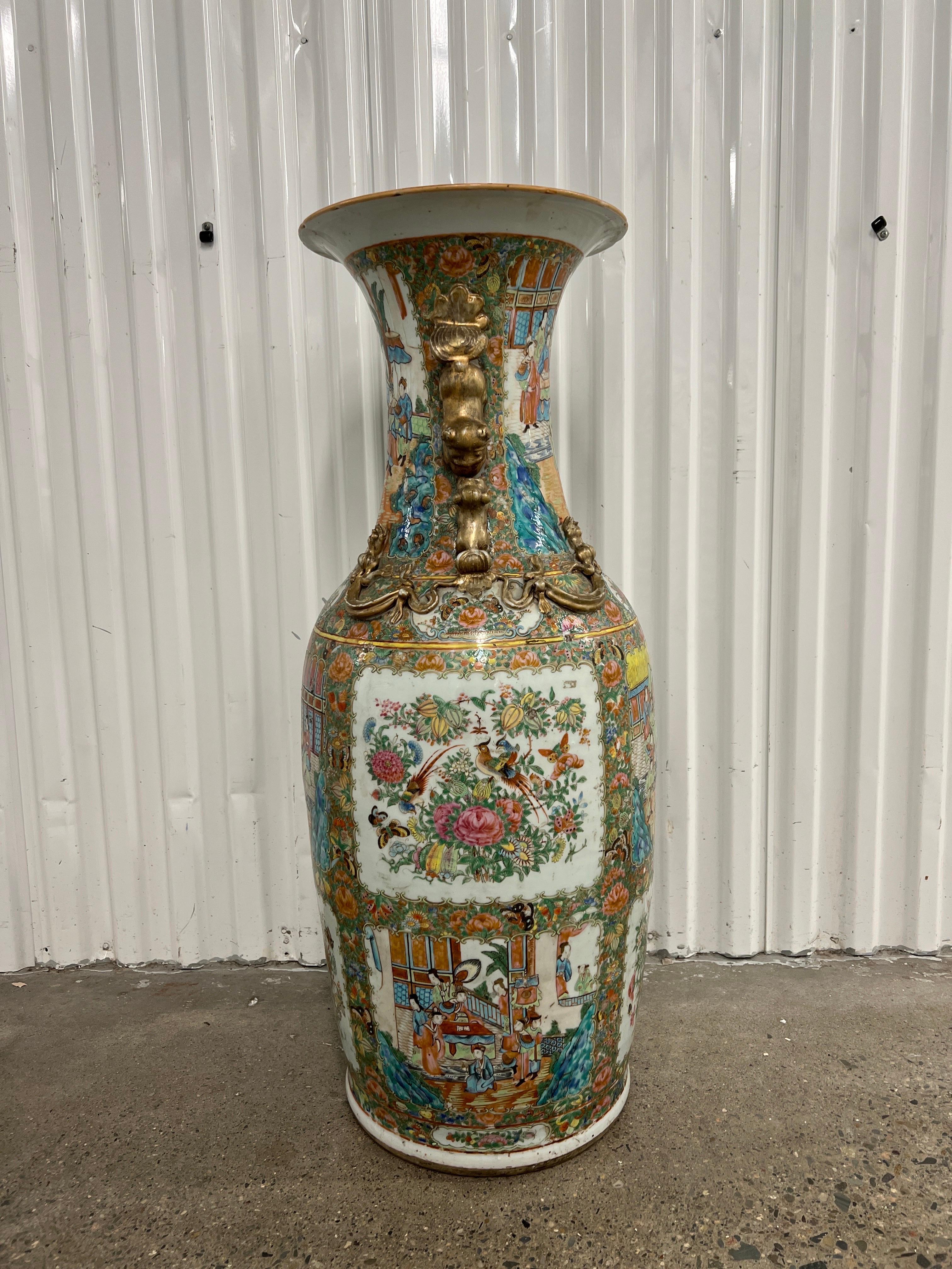 Chinese, late 19th century.

A palace size Rose Medallion floor vase. The vase is decorated with polychrome enameled surface, several figural scholar windows and gilt decorated foo dog handles. Unmarked to underside.