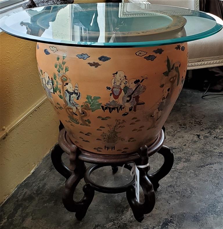 Presenting an impressive and beautiful large chinese fish bowl side table with stand.

Famille L’Orange in style, with hand painted Chinese/Oriental figures in traditional attire, playing musical instruments etc. in garden scenes.

Fish painted