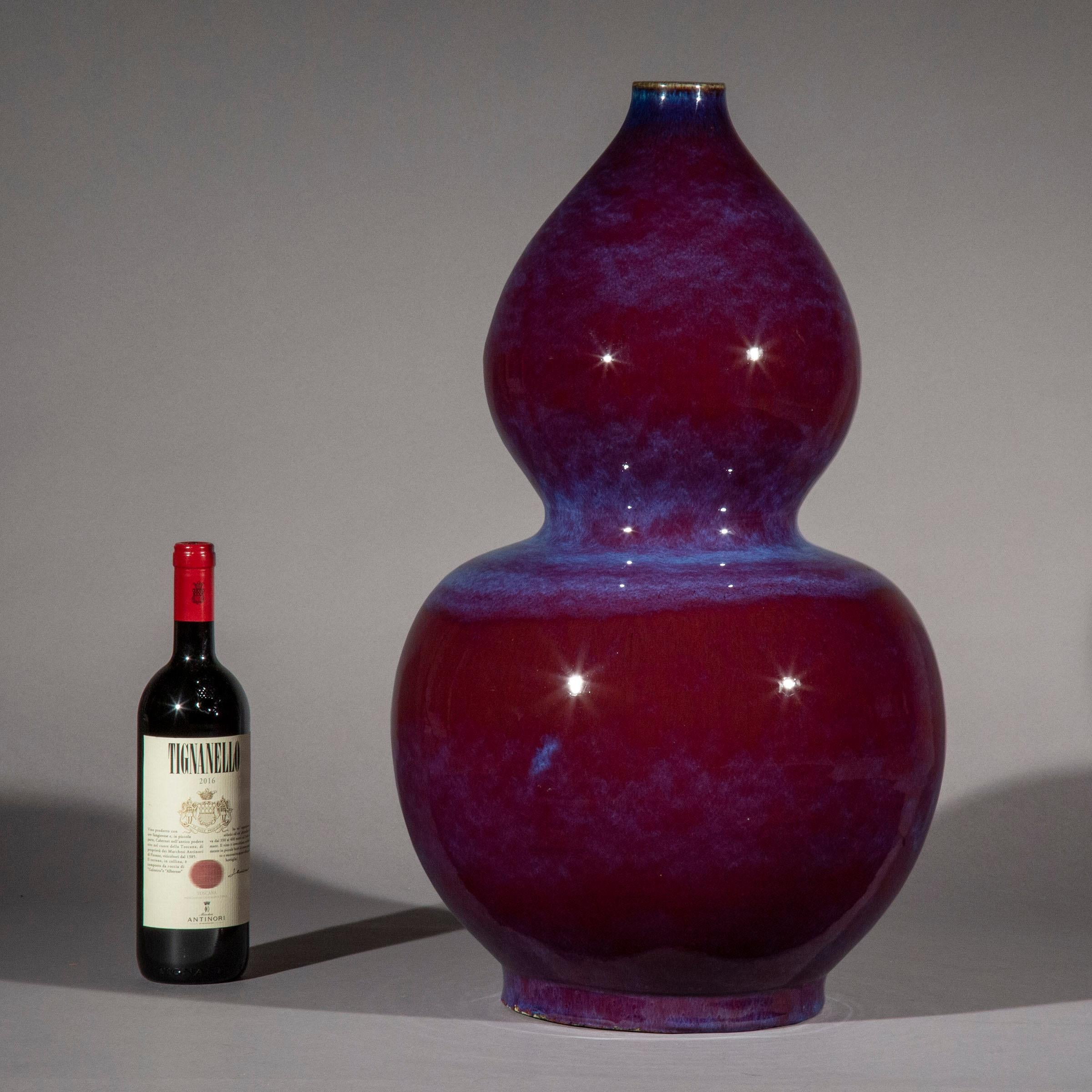 A wonderfully decorative vase of massive proportions, beautifully glazed with purple and blue streaks.

China, 20th century

We love the vivid colours and the intricate pattern of the glaze, as well as the rare impressive proportions of the vase. A