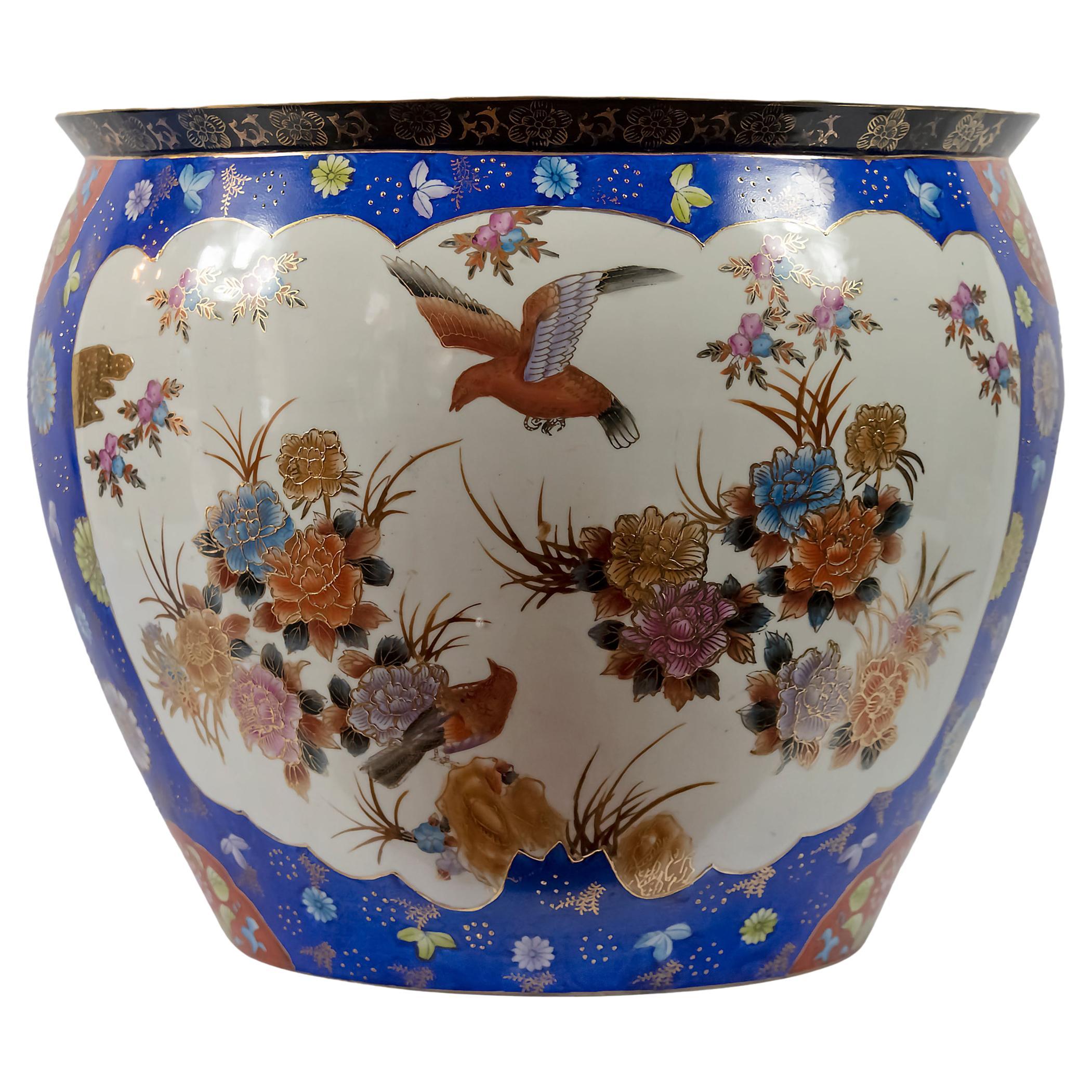 Large Chinese ceramic planter pot fish basin with hand painted birds, flowers as well as the inside with aquatic plants and fish painted in many colors.
Approx. 12 kg.
 