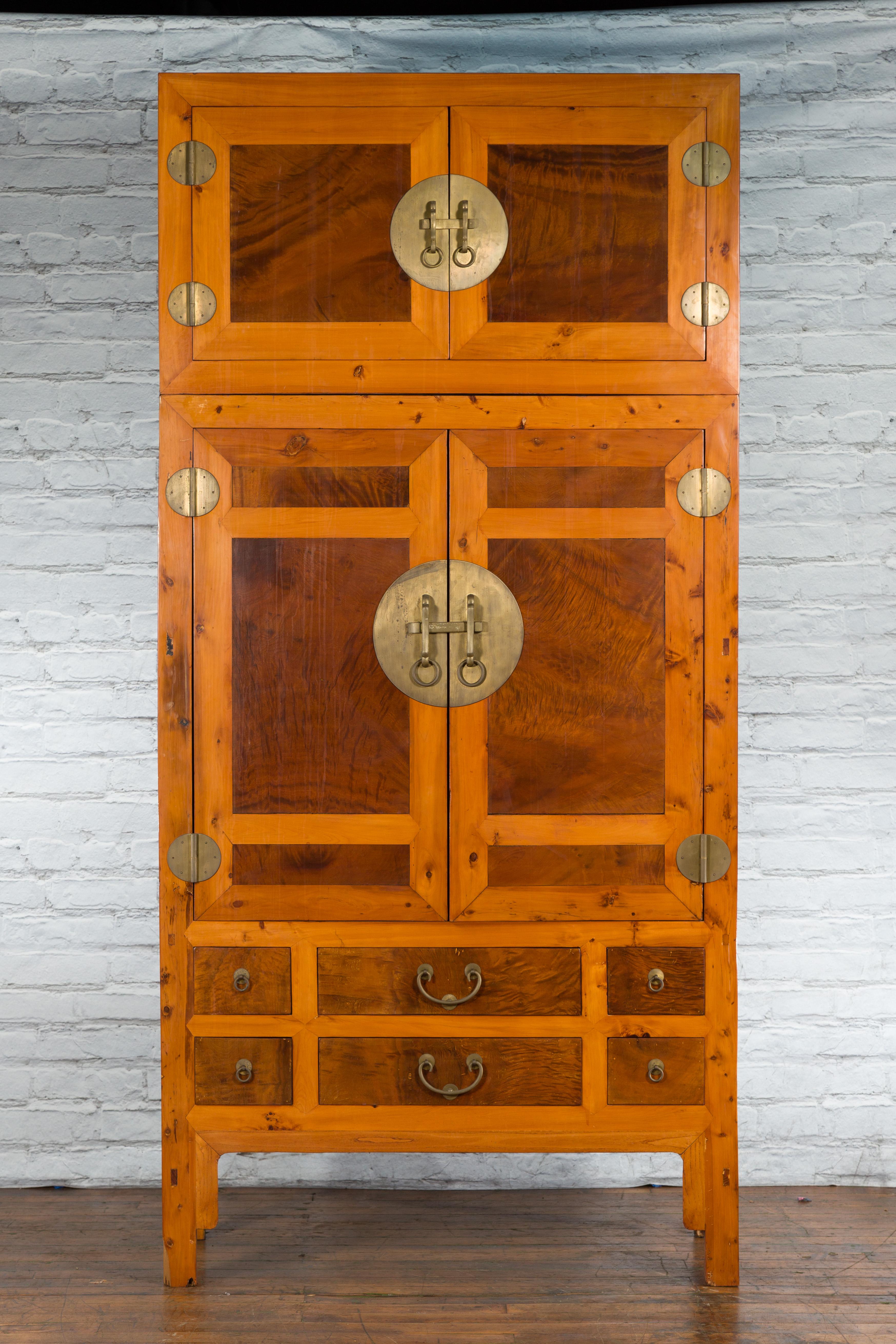 A large Chinese Hebei Turn of the Century burled wood two toned compound cabinet from the early 20th century, with four doors, multiple drawers and brass hardware. Created in Hebei, China in the early years of the 20th century, this compound cabinet