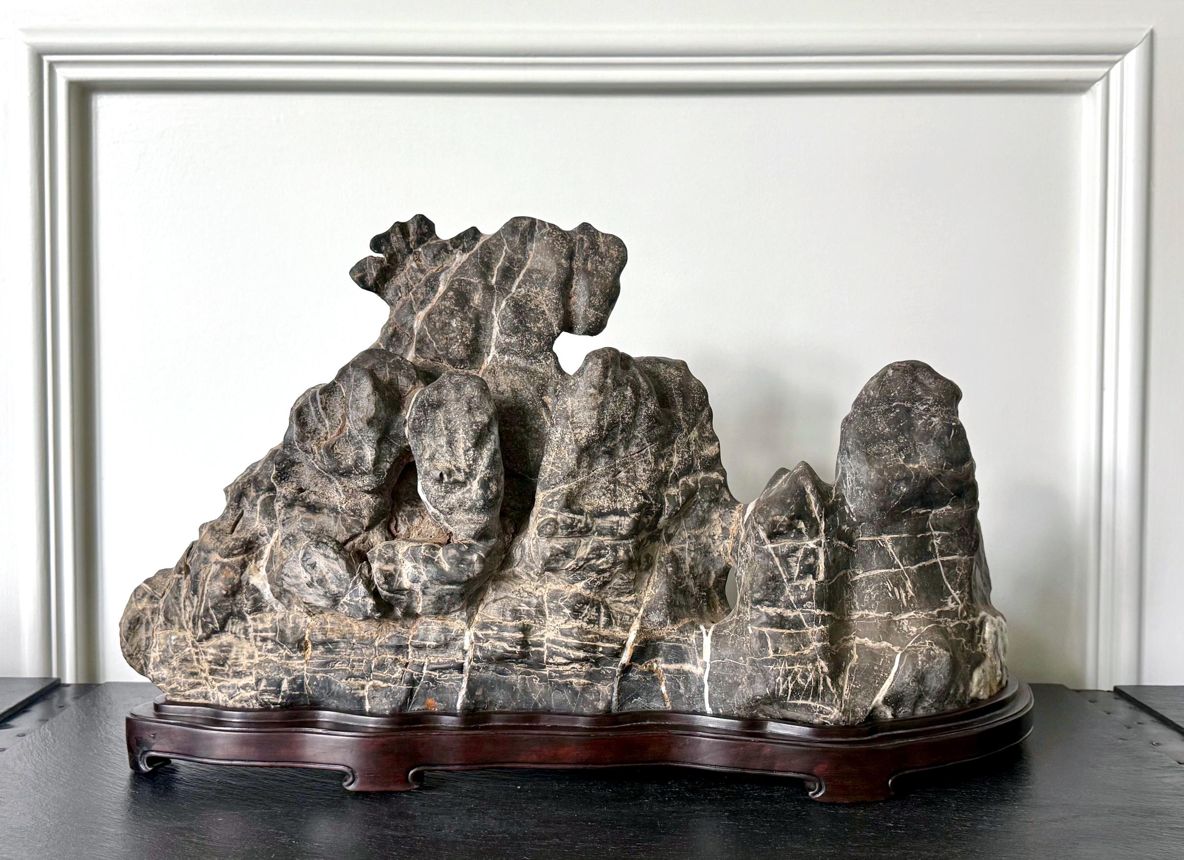 Large Chinese Horizontal Gray Lingbi Scholar Stone with Grotto on Display Stand For Sale 6