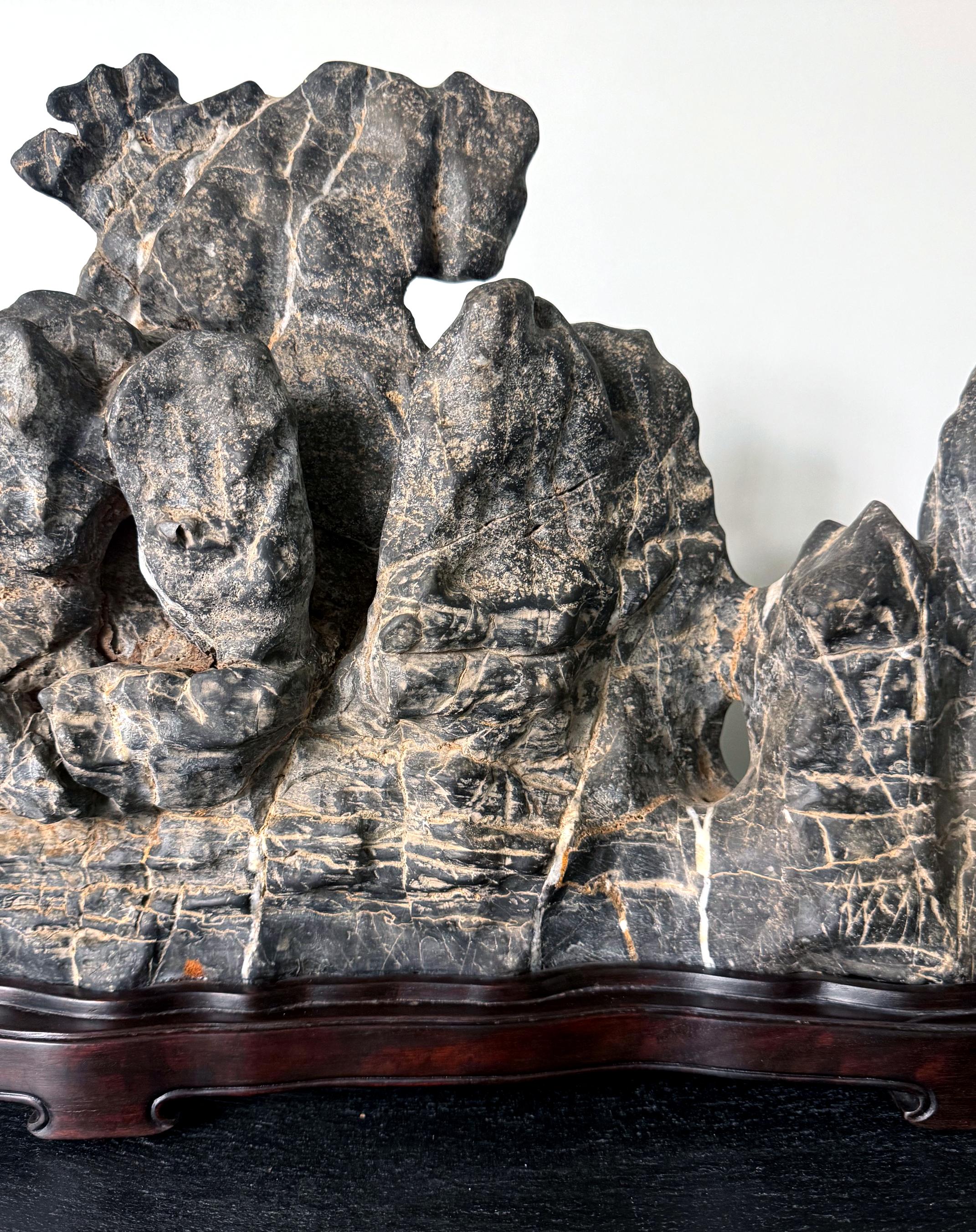 Large Chinese Horizontal Gray Lingbi Scholar Stone with Grotto on Display Stand For Sale 8