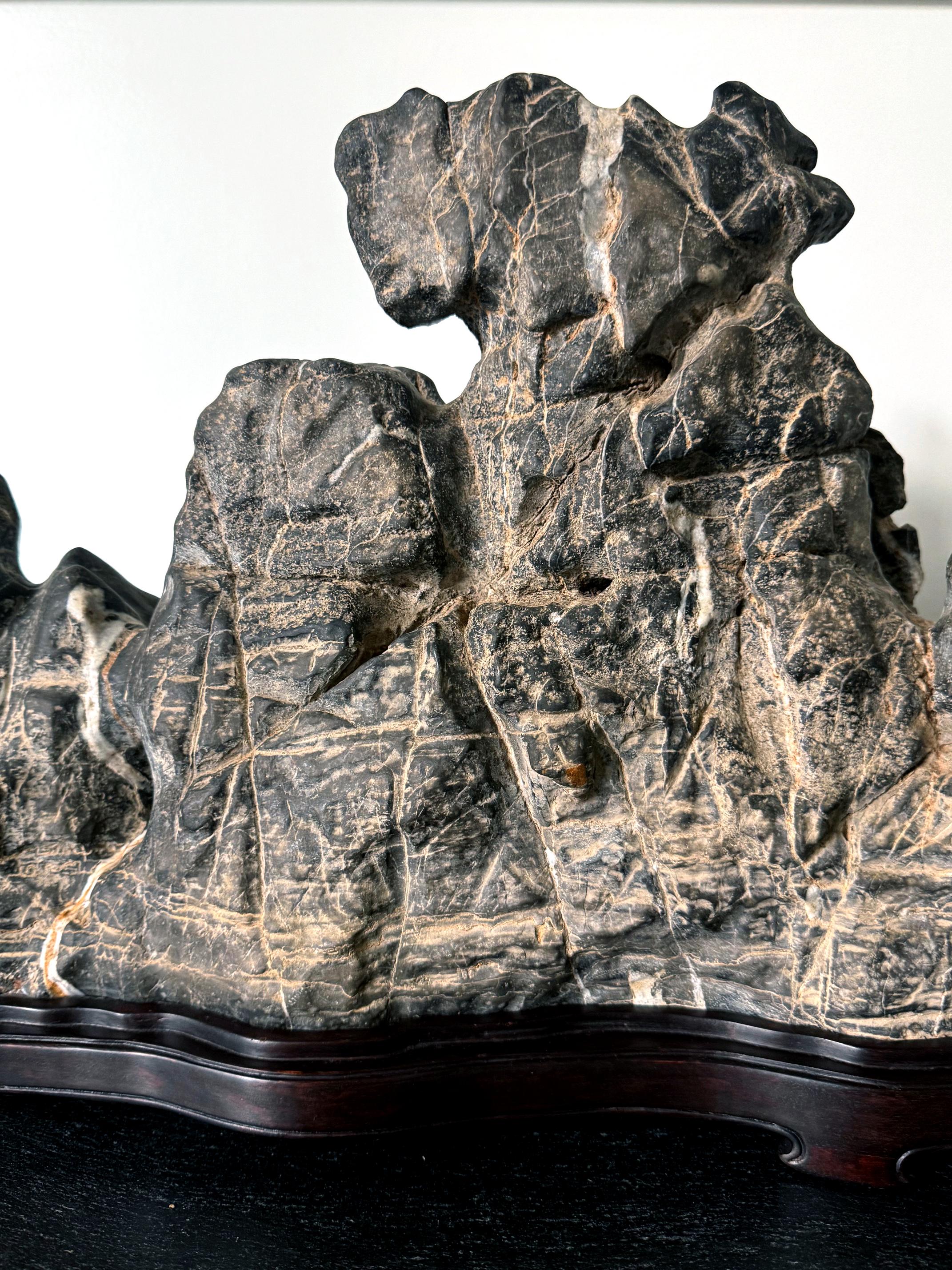 19th Century Large Chinese Horizontal Gray Lingbi Scholar Stone with Grotto on Display Stand For Sale