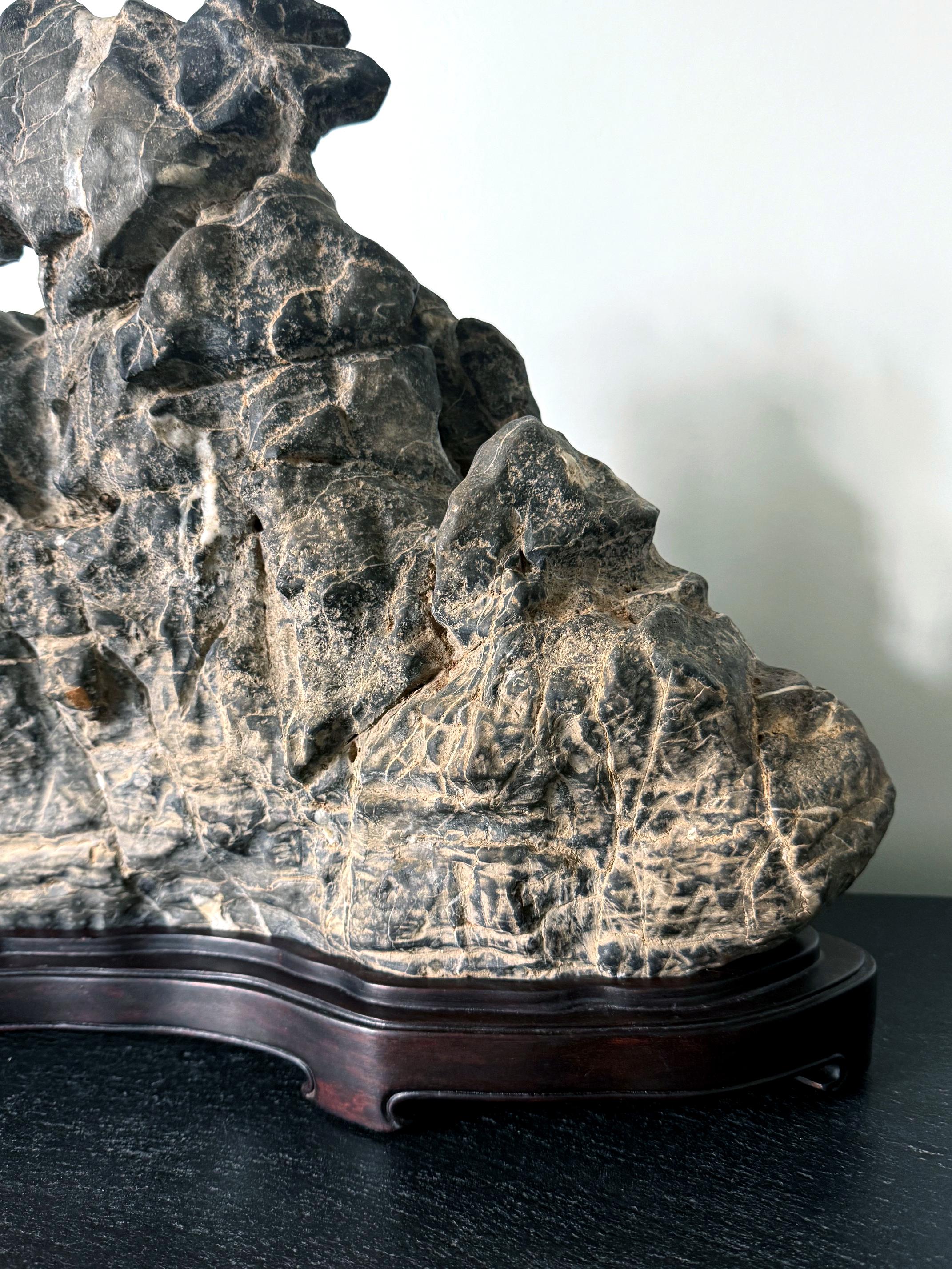 Large Chinese Horizontal Gray Lingbi Scholar Stone with Grotto on Display Stand For Sale 1