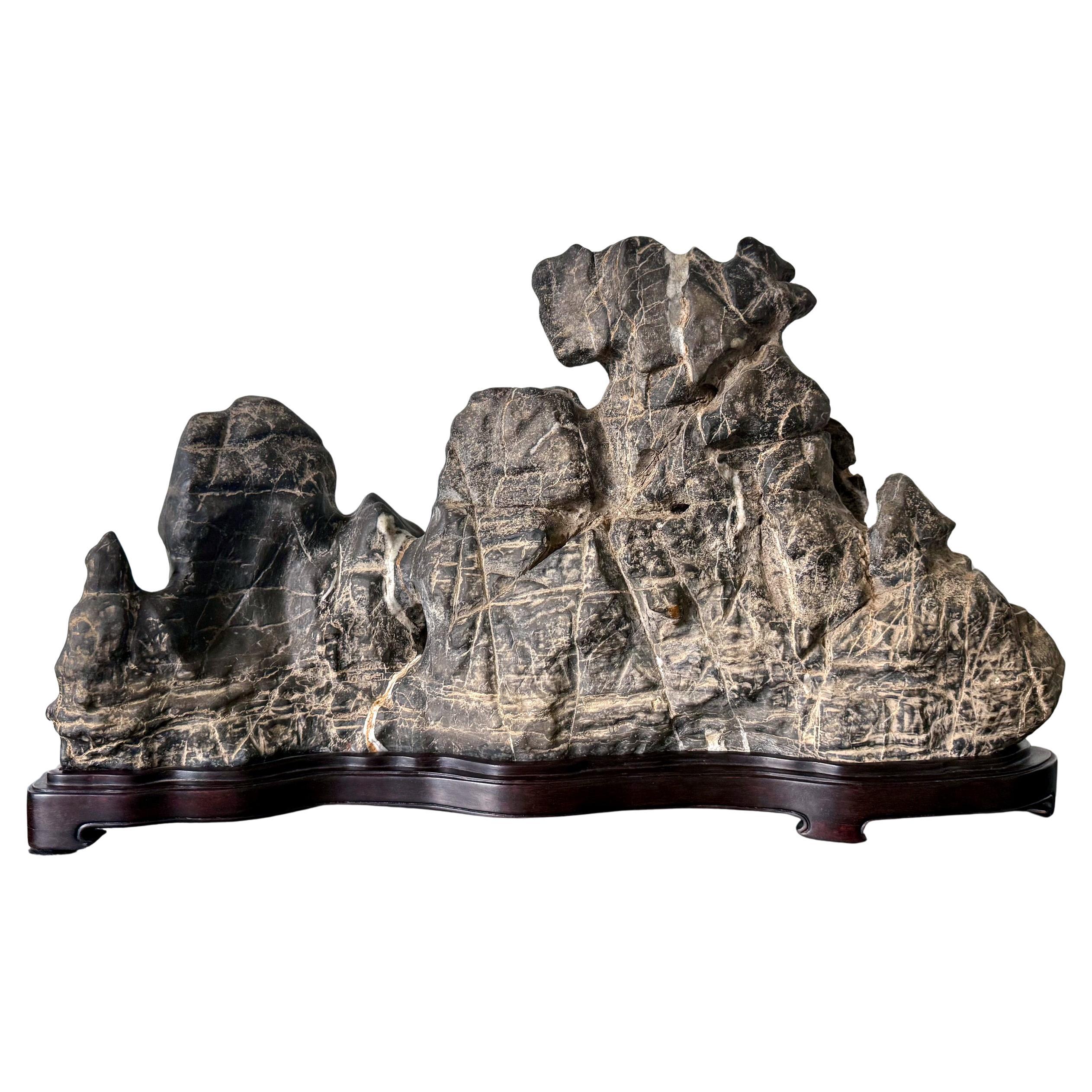 Large Chinese Horizontal Gray Lingbi Scholar Stone with Grotto on Display Stand For Sale