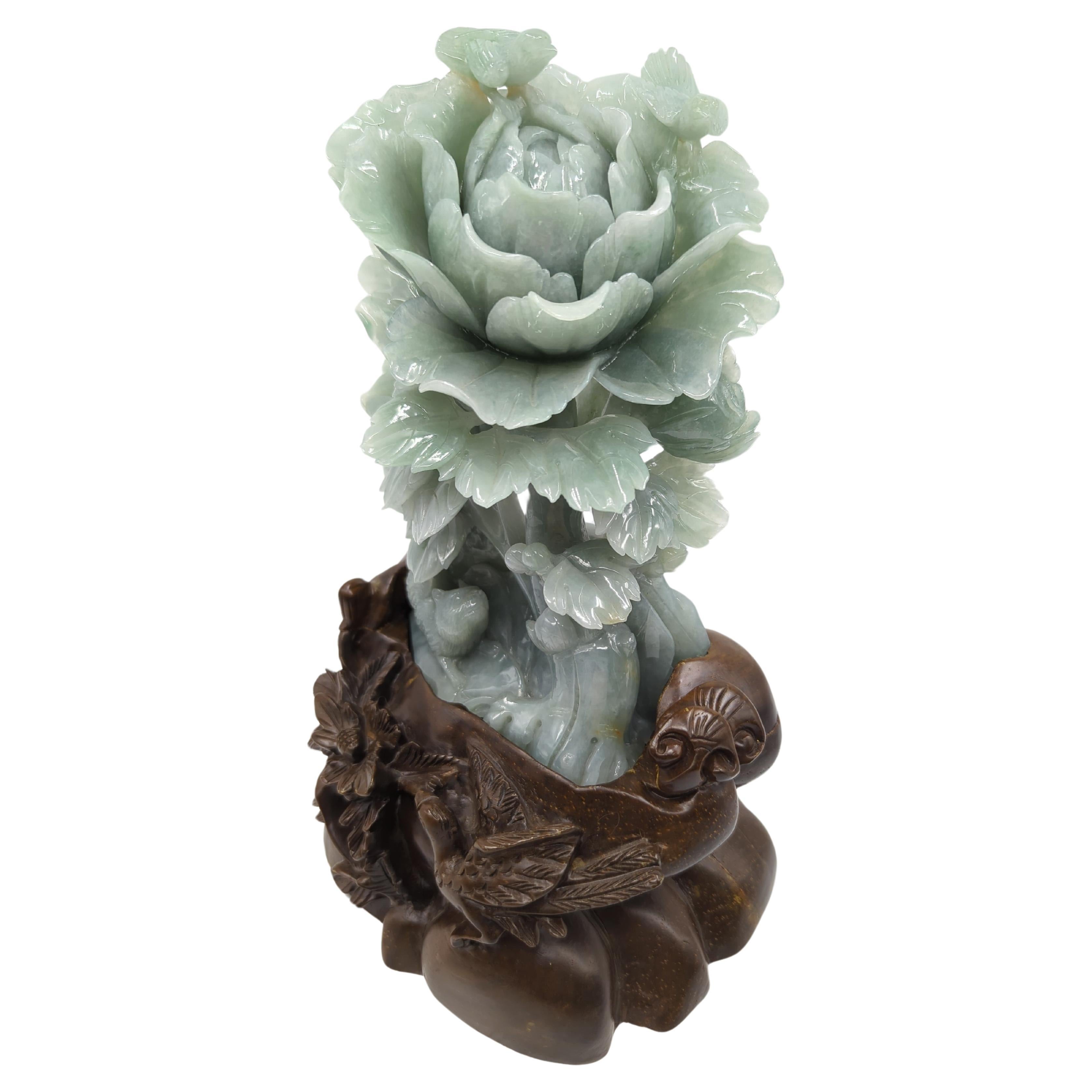 This modern Chinese sculpture, standing at an impressive 10 inches on its stand, is a masterful representation of contemporary jadeite craftsmanship, particularly from the renowned Suzhou tradition. Carved from natural, untreated jadeite, the