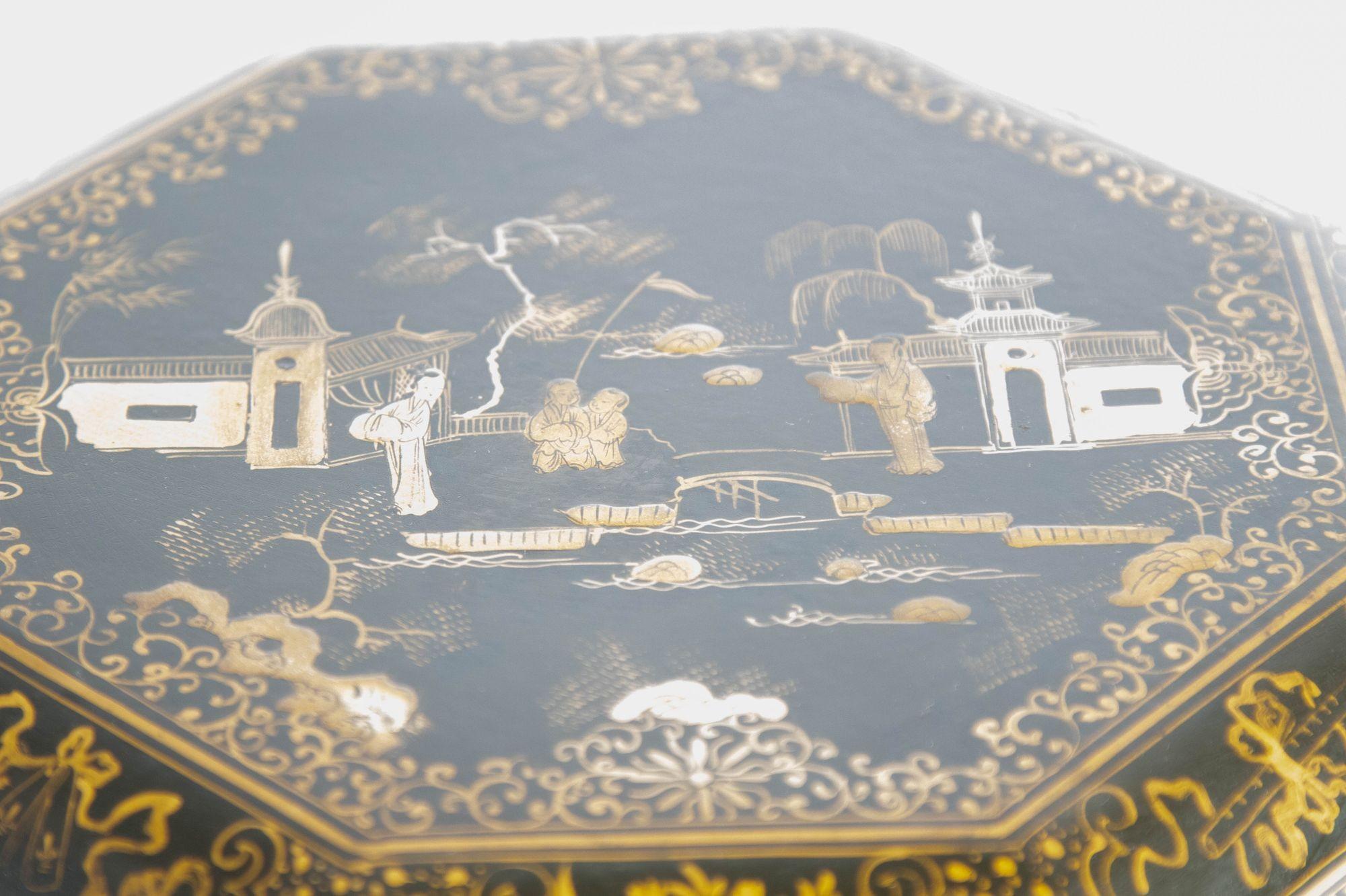 Large Chinese Export Octagonal Black Lacquered Gilt Painted Covered Box 1950s.
Chinese lacquer box with numerous figures and gilt detail.
Large Chinese black lacquered box with numerous figures and gilt detail.
Chinese black lacquer and gilt painted