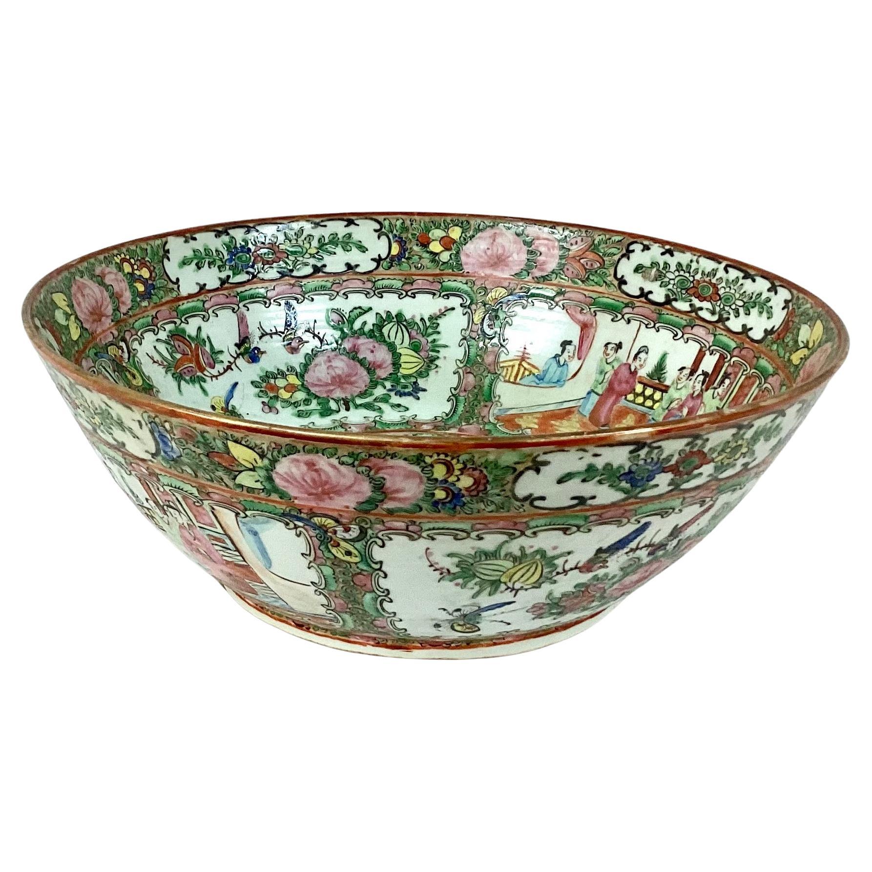 Large colorful vintage Chinese export famille rose medallion porcelain bowl. Features classic oriental scenes with Chinese people throughout. Overall, the piece is in wonderful condition with a beautiful vivid multi-color palette.

