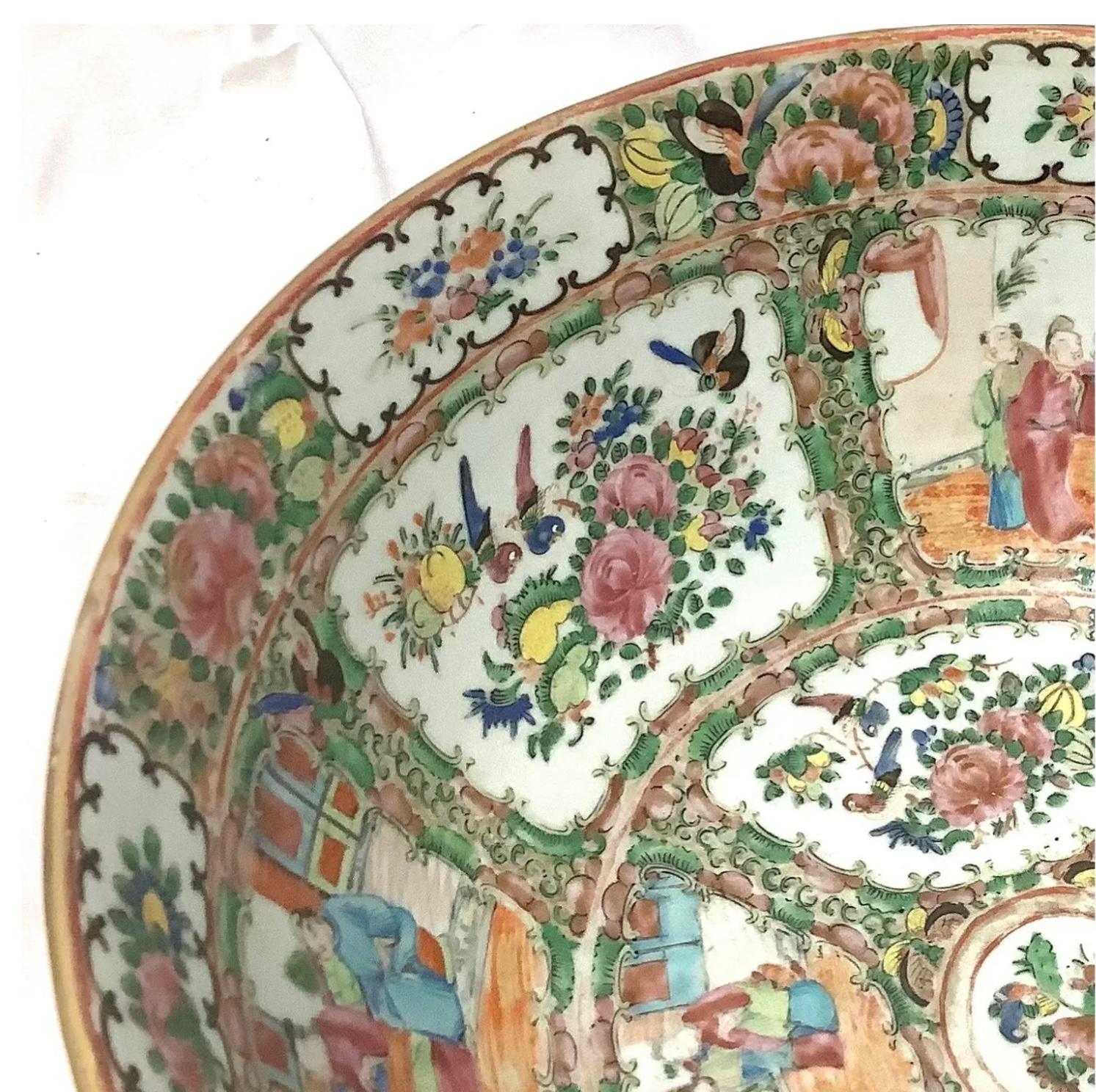 Large colorful vintage Chinese famille rose medallion porcelain punchbowl. Features classic oriental scenes with Chinese people throughout. Overall, the piece is in wonderful condition with a beautiful vivid multi-color palette.

