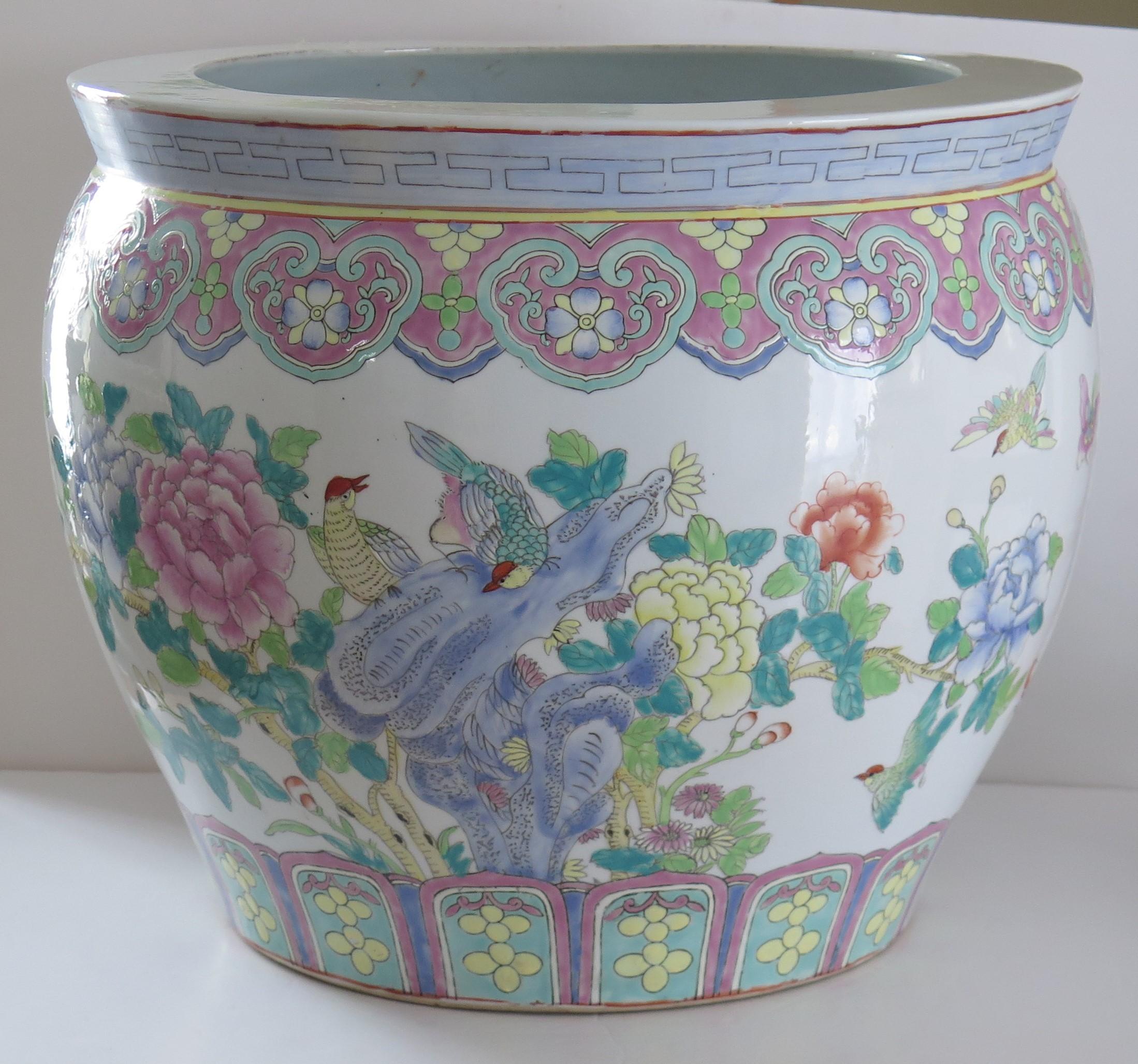 This is a good, large, Chinese Export porcelain Jardiniere (Cachepot) or Fish Bowl, hand decorated in a Famille-Rose pattern and dating to the mid-20th century.

This piece is well potted with a good shape and wide diameter.

It is hand