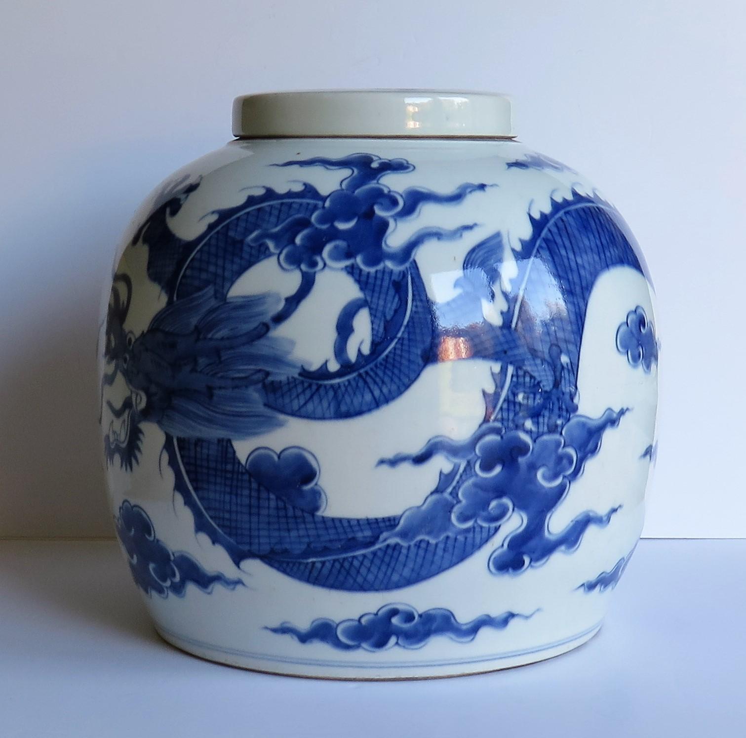 This is a very large Chinese porcelain blue and white lidded or covered jar with a hand painted imperial dragon and double circle mark to the base. This jar is Chinese export in the earlier Kangxi period style.

The jar is hand potted and comes