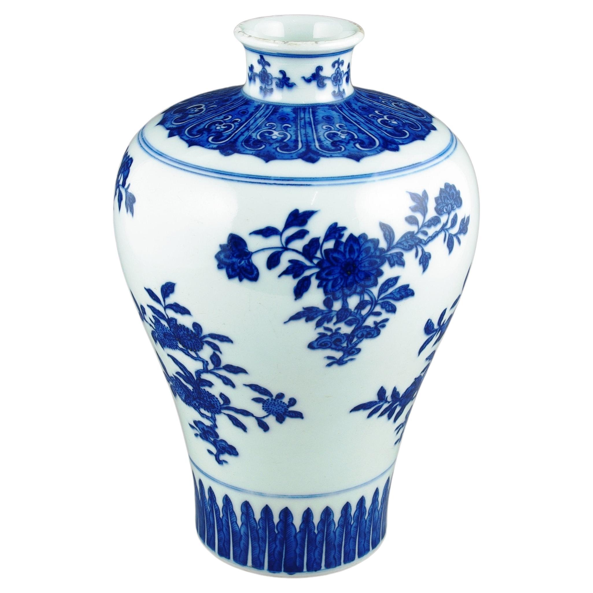 We are pleased to introduce this modern 20th-century Chinese porcelain blue and white Meiping vase, a splendid blend of expert craftsmanship and hand painting skills of the artisan and traditional Qing style aesthetics. This vase stands as a