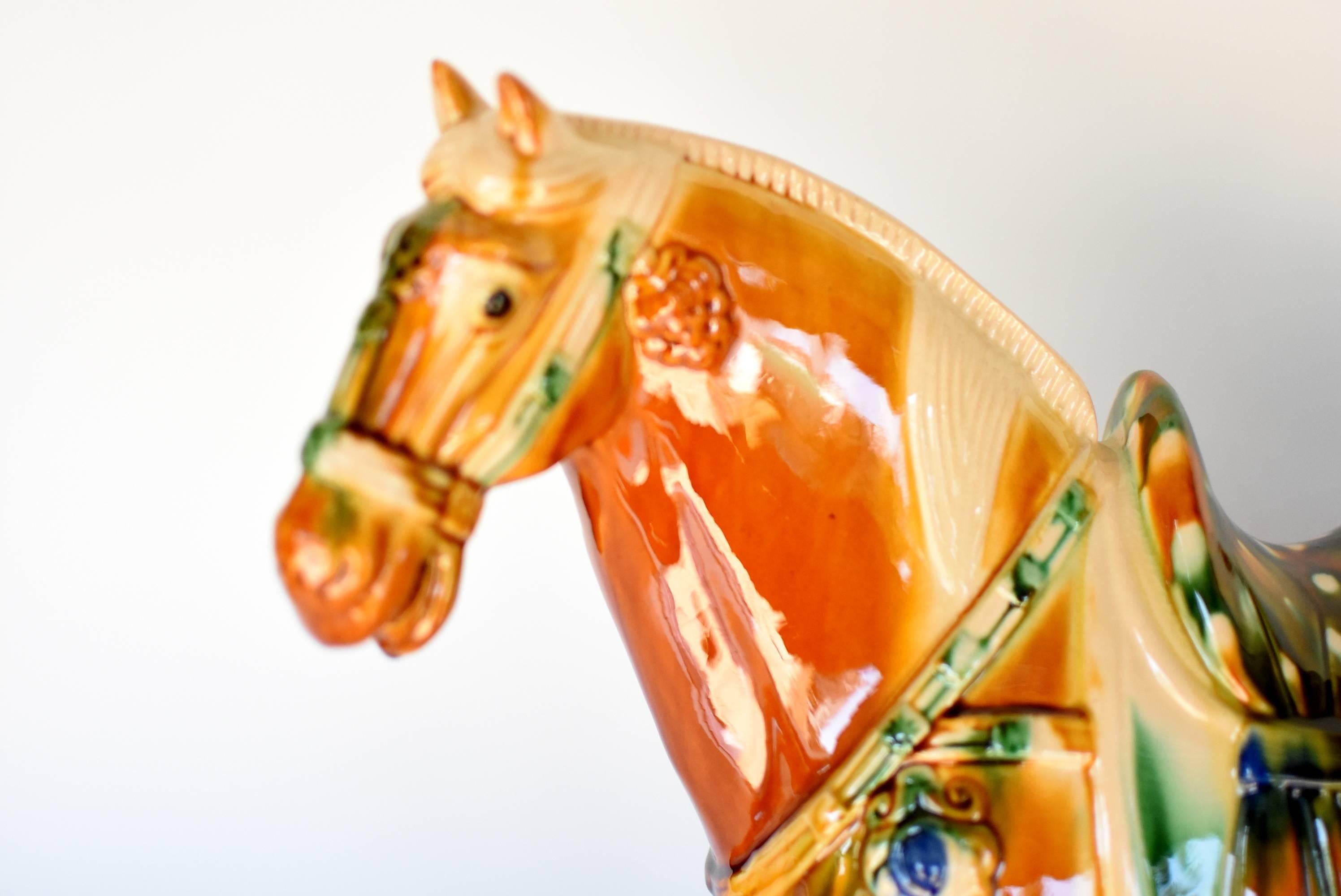 A beautiful caramel San Cai horse in high gloss. The Sancai technique dates back to the Tang dynasty (618–907AD). This wonderful piece has all the hallmarks of Tang San Cai terracotta potteries with skilfully applied glaze achieving amazing artistic