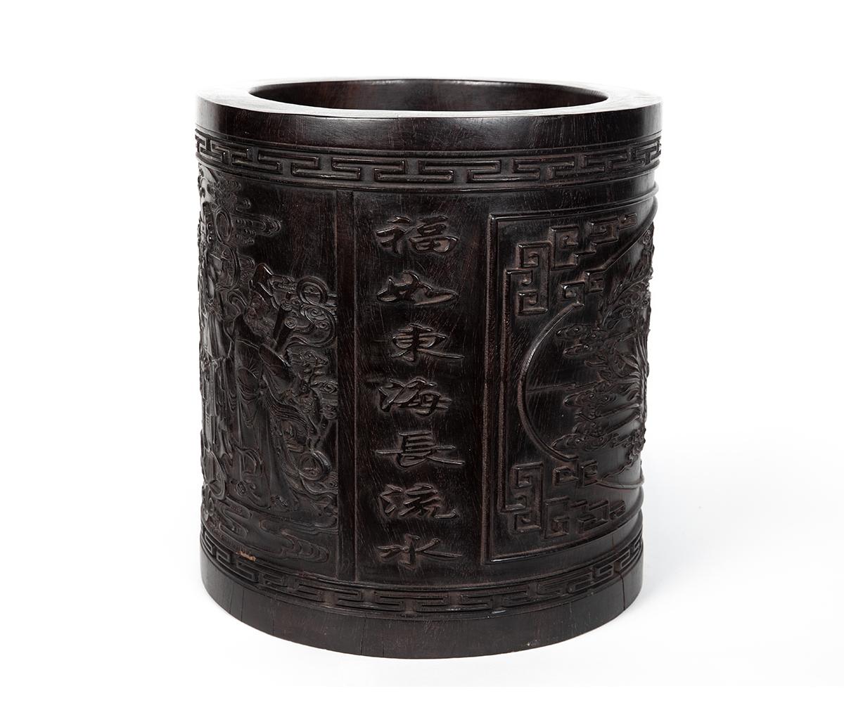 Large Chinese Qing carved Zitan brush pot with a stunning depiction of a Buddha god holding a scepter and a breathtaking carving of a dual between a Phoenix and a Dragon over the holy pearl.