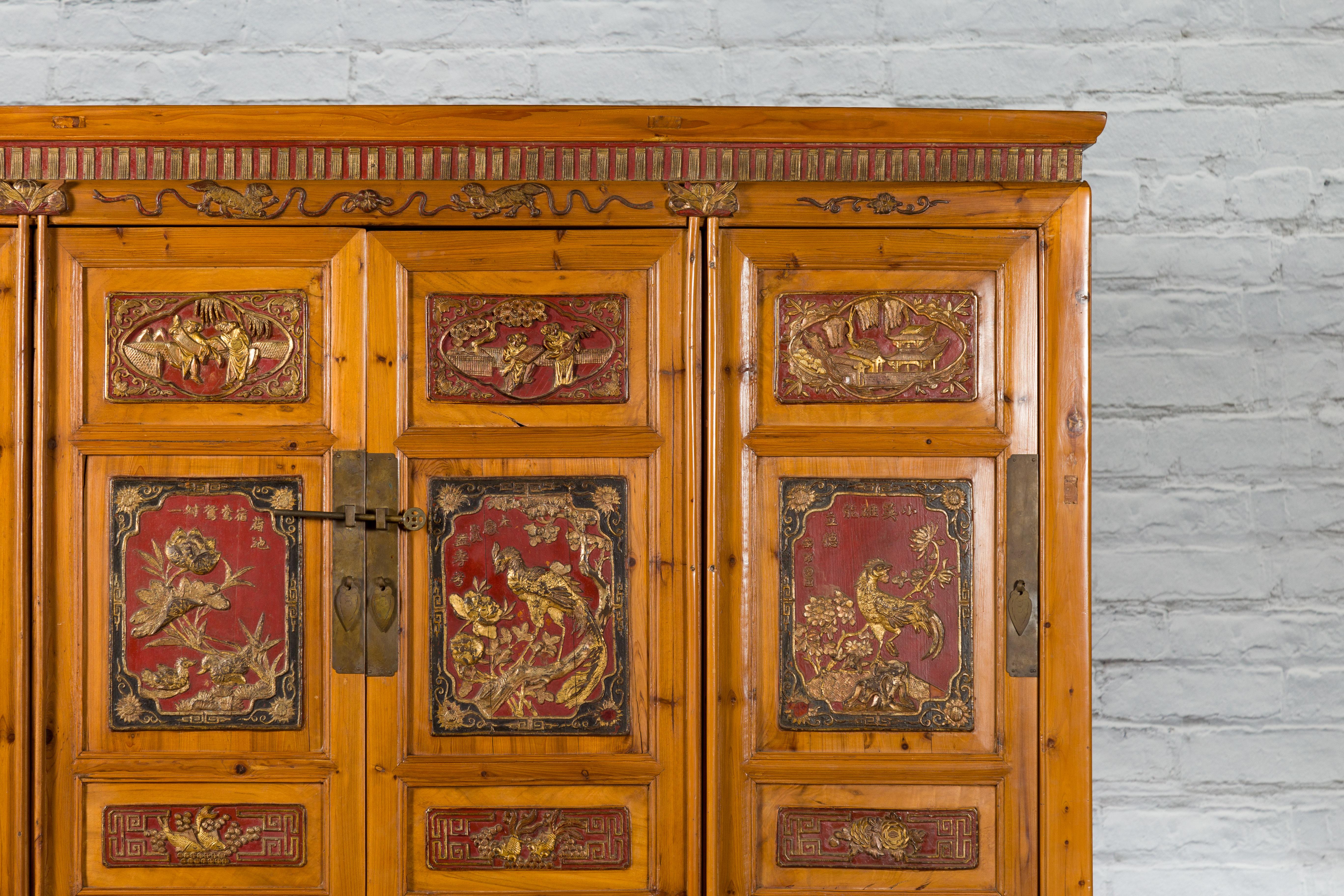 Wood Large Chinese Qing Dynasty 19th Century Cabinet with Hand-Carved and Gilt Panels For Sale