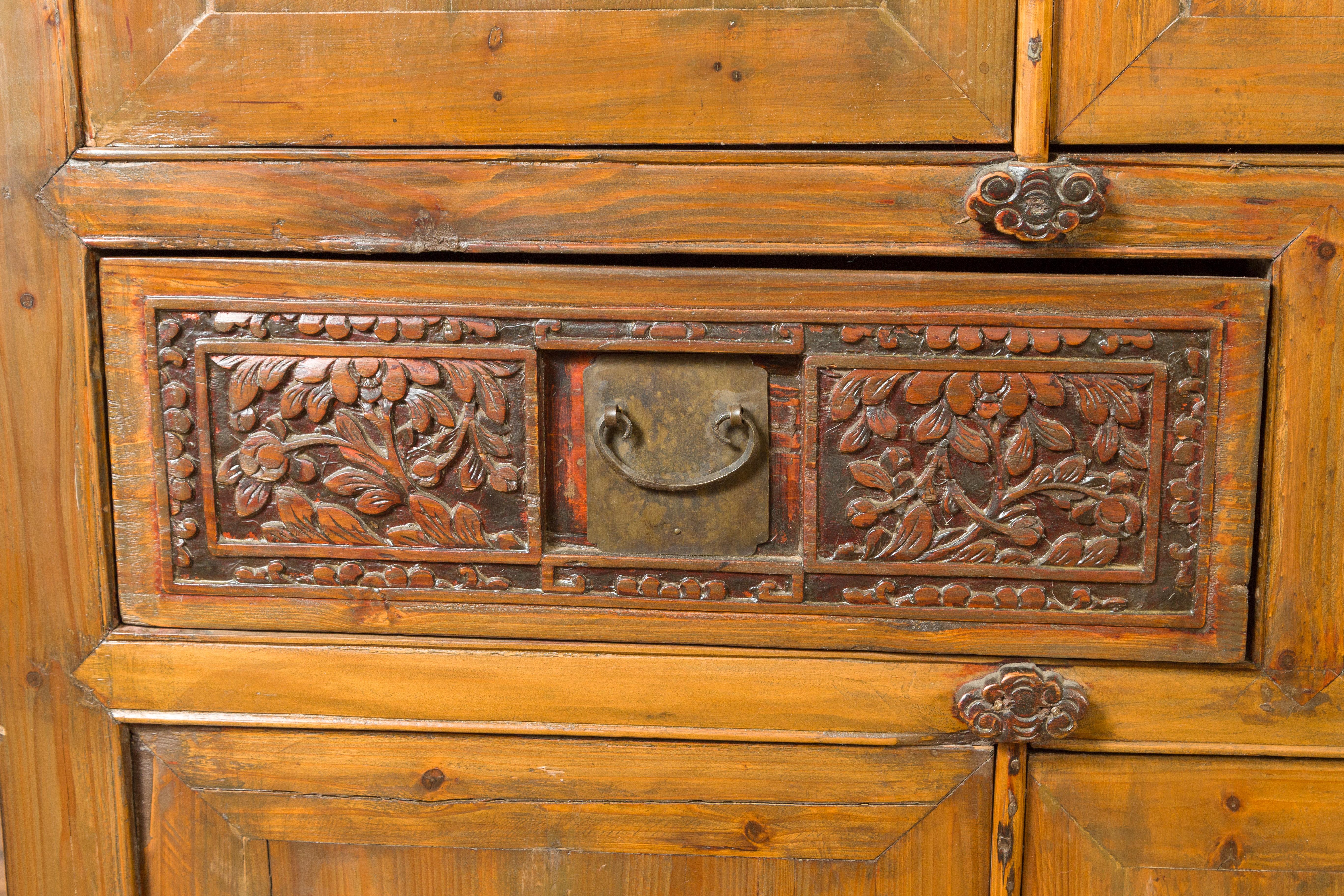Large Chinese Qing Elm Armoire with Carved Motifs and Red Lacquered Accents For Sale 4