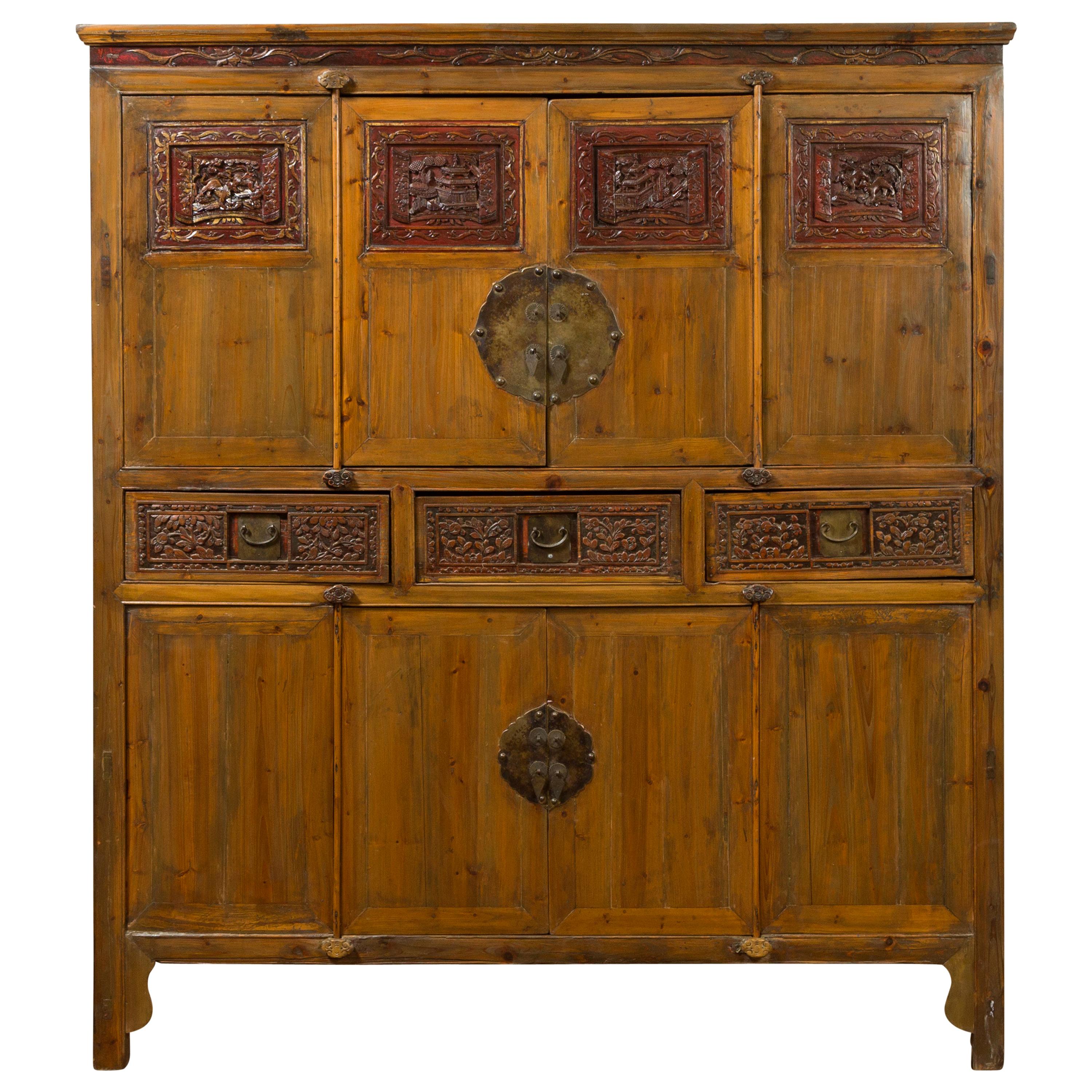 Large Chinese Qing Elm Armoire with Carved Motifs and Red Lacquered Accents