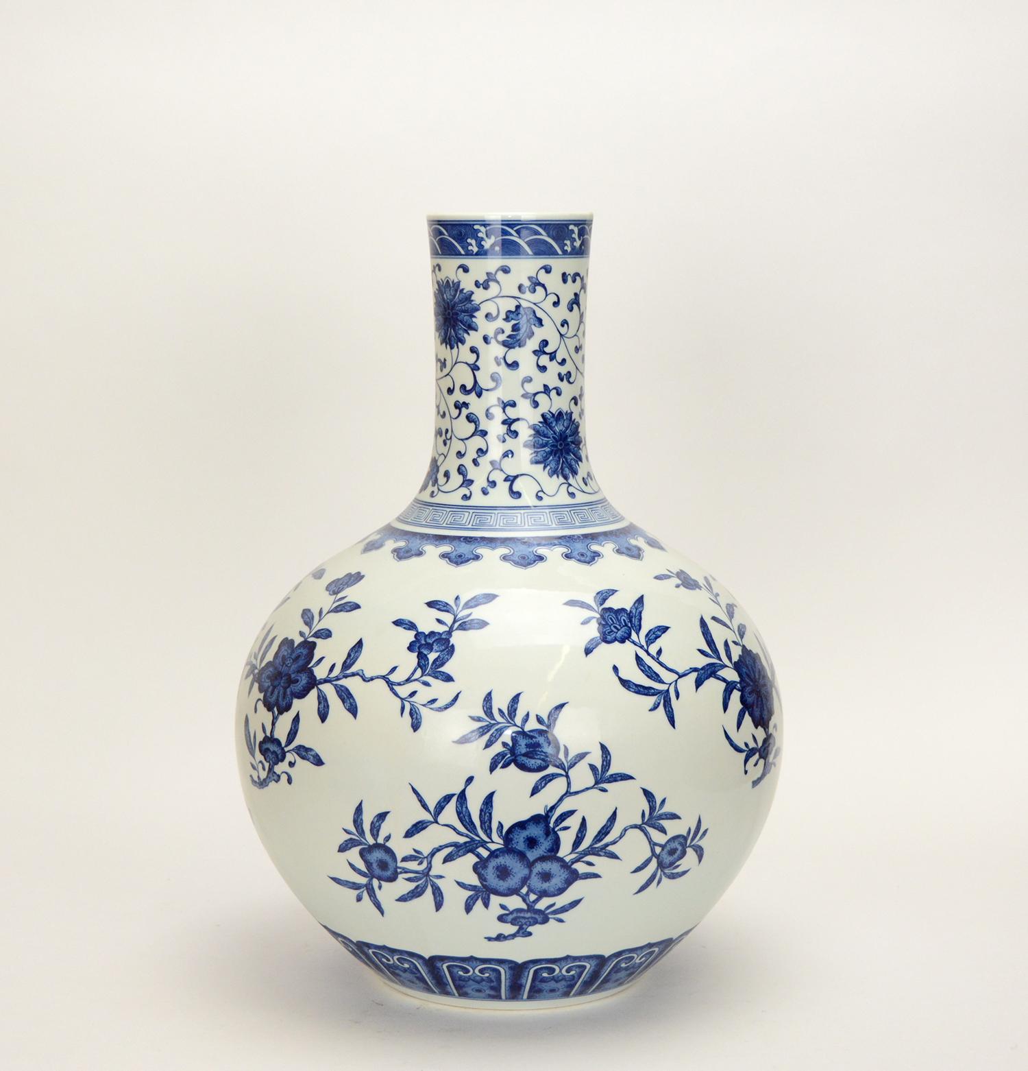 A beautiful hand painted Chinese porcelain vase with blue and white flowers. A fine example of Chinese Qing Qianlong style vase. Underneath it has a 6 character Chinese seal marking. This vase measures 19 inch tall.