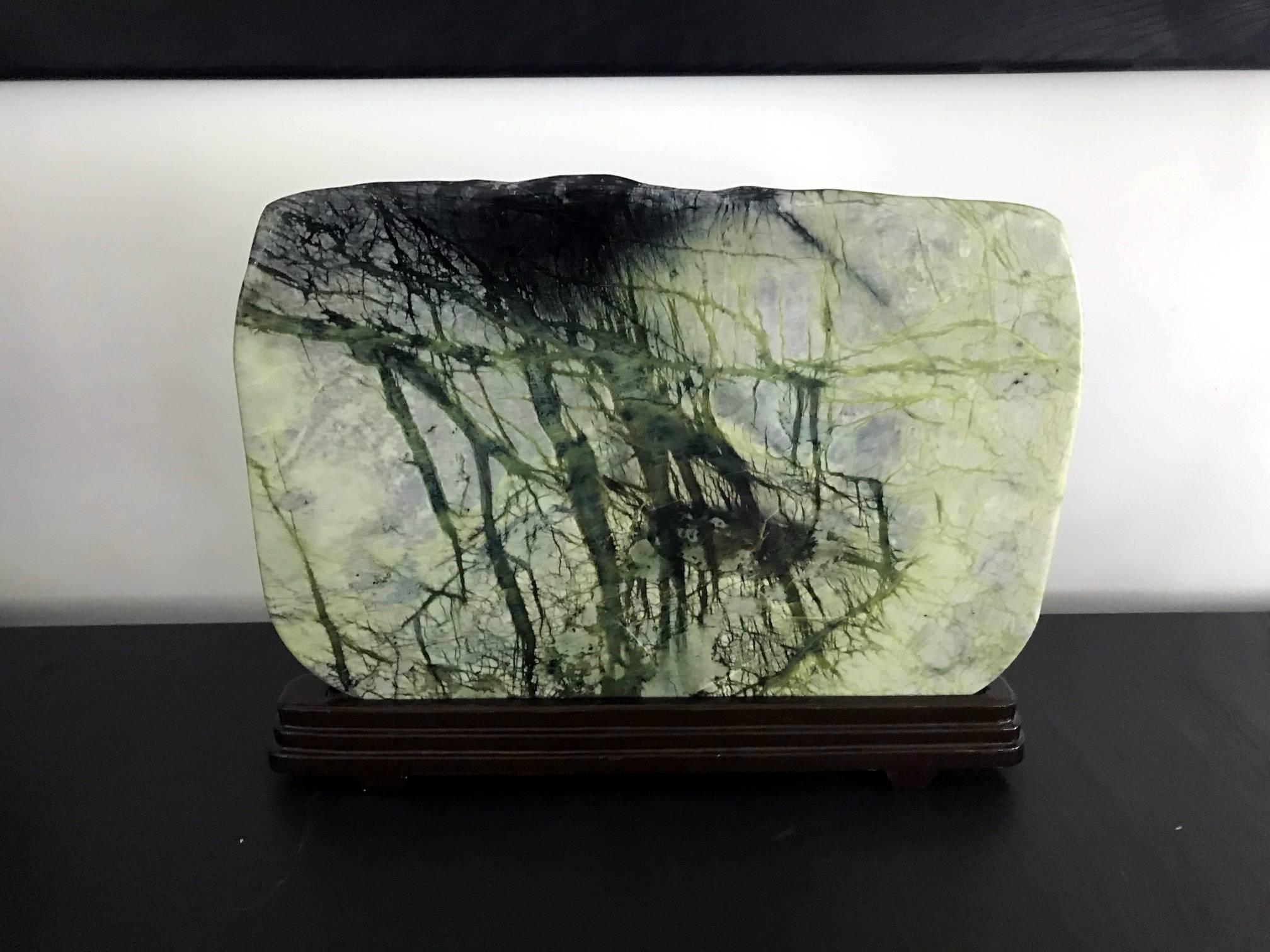A beautiful scholar stone in the form of a jade plaque with natural green veins that resemble bamboo shoots, which show on both sides. This type of greenery stone is likely collected from Northeastern province of Liao Ning in China. It consists of