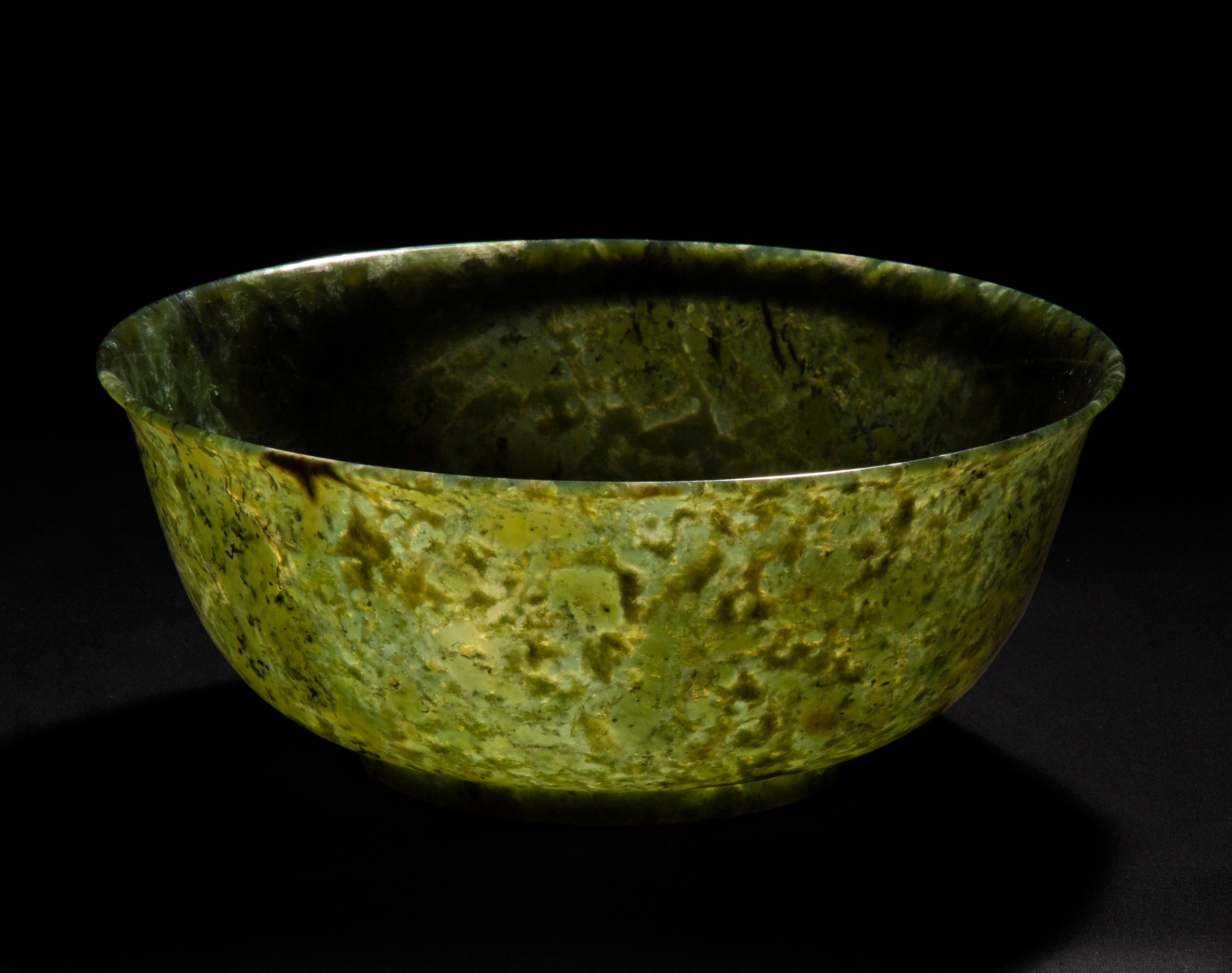 An exceptional 'Spinach Green' jade bowl, of uniquely large size.
China, 20th century.

Why we like it
Jade bowls of this fine quality and wonderful colour are incredibly rare and almost impossible to find in this large size. The Fine cut lends