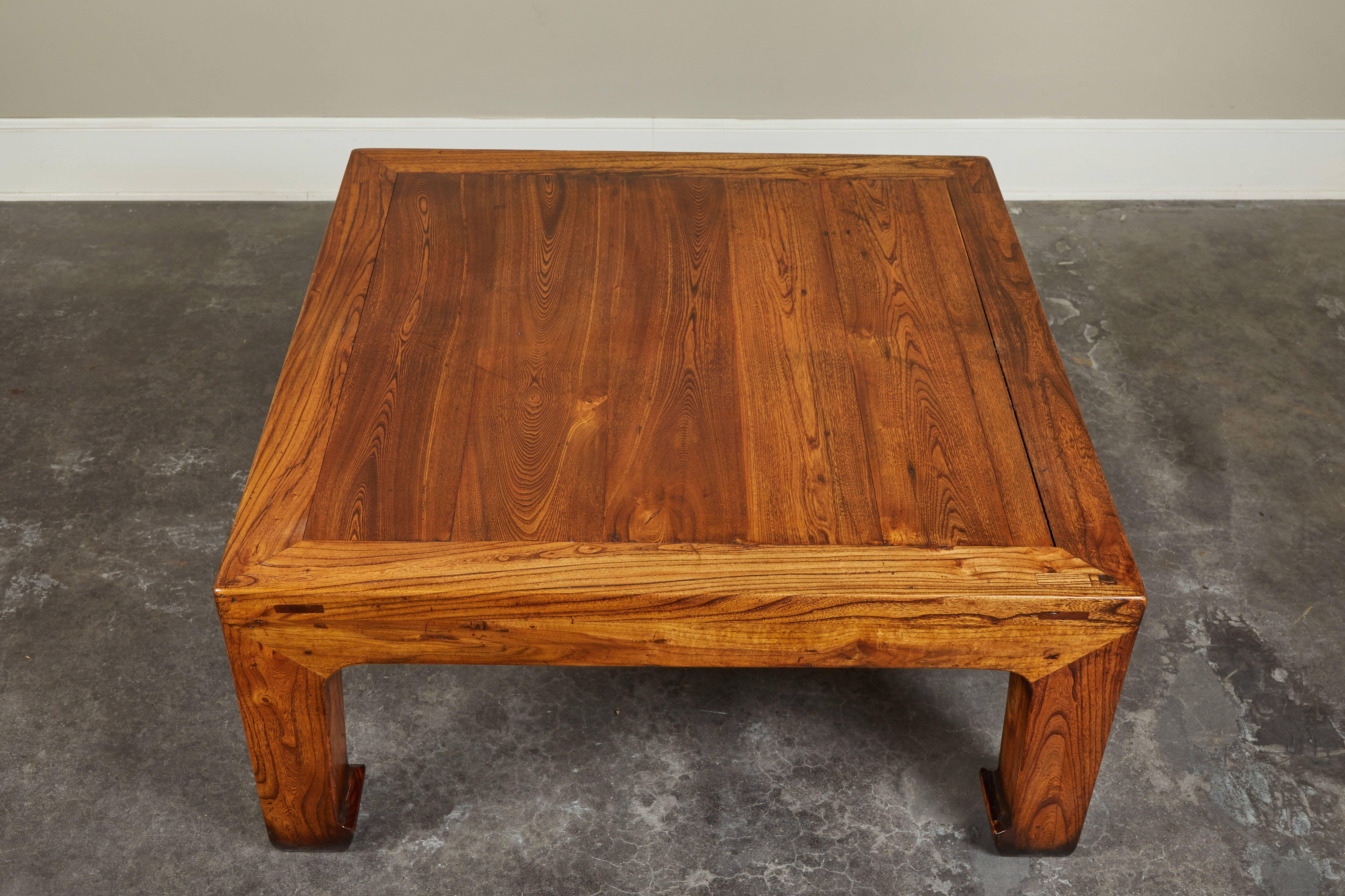 One of two similar Chinese elm coffee tables, re-imagined from salvaged pieces of an antique bed. Could be paired with a similar piece (ref:LU868810760871).