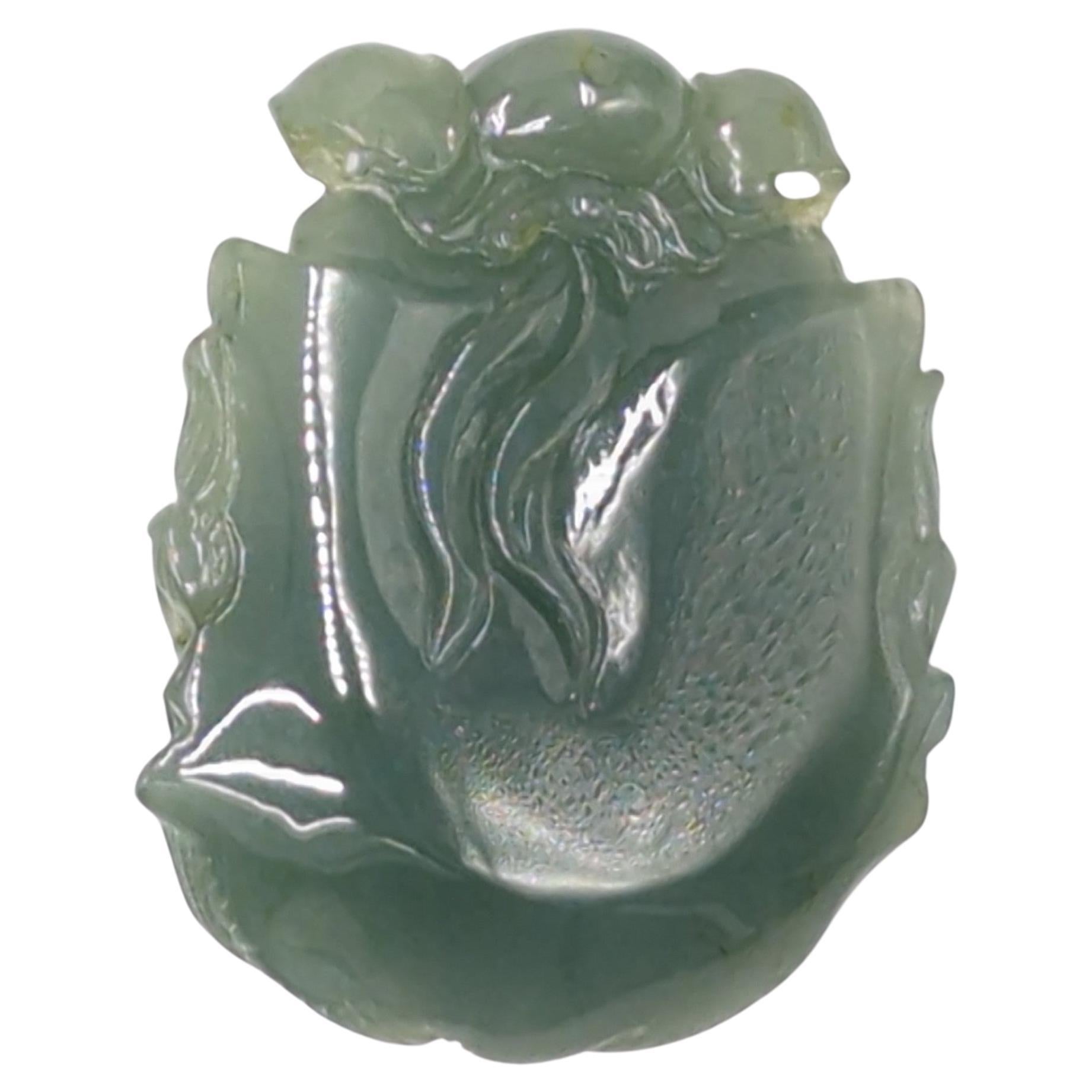 A large Chinese Suzhou workshop master artisan hand carved jadeite (natural A-grade) pendant in the form of Zhong Kui (Demon Queller in Chinese mythology) head. The details of this impressive pendant are very finely carved, and the natural jadeite